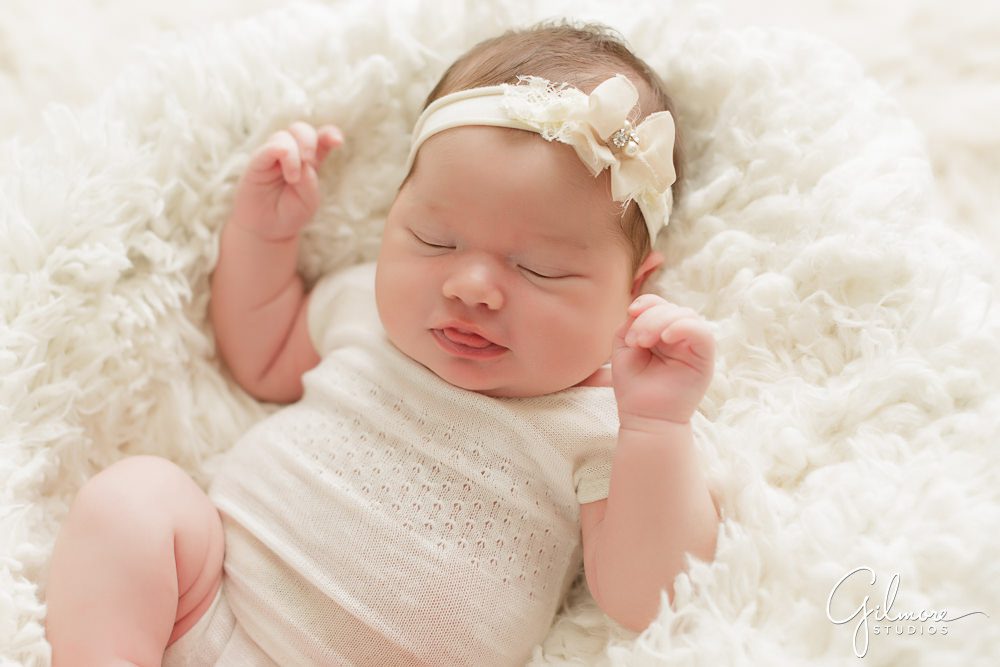 Orange County Newborn, sleeping baby, flower headband, white blanket, outfit, portrait photography studio, pose