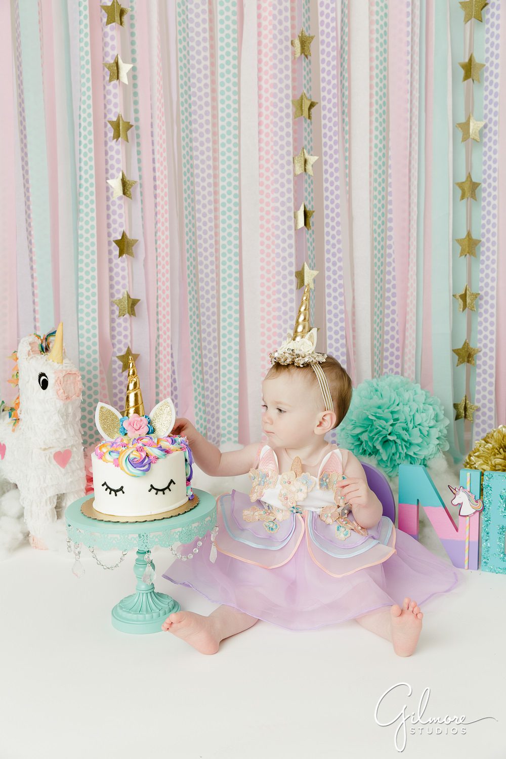 Unicorn Theme Cake Smash, stars, background, backdrop, baby girl, first birthday photo shoot, portrait studio, props, streamers, pinata