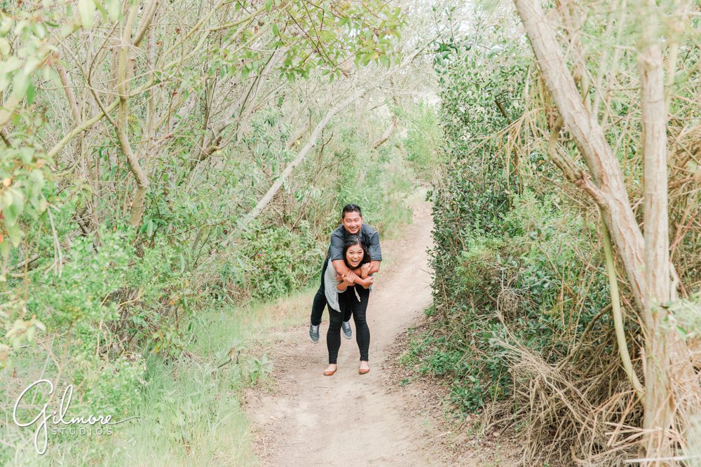 Corona Del Mar Beach Engagement Session, funny photo, fun photo, hike, hiking, buck gully trailhead, forest, natural light, portrait