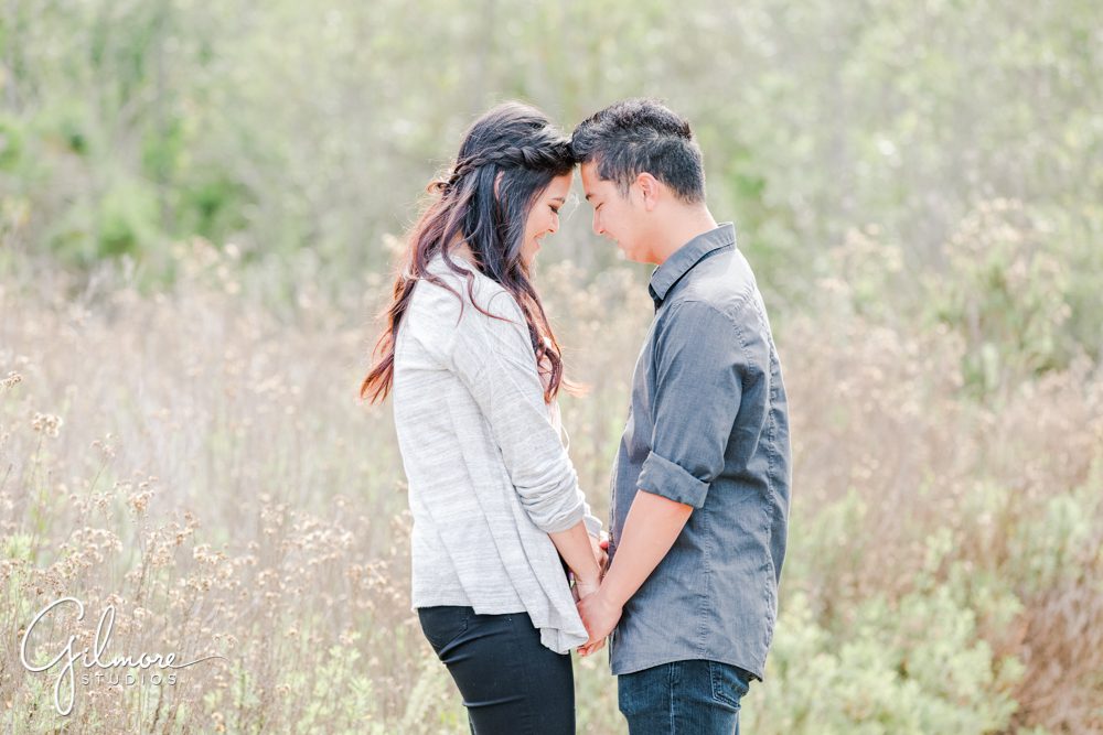 Corona Del Mar Beach Engagement Session, holding hands, engaged, couple, hike, hiking, buck gully trailhead, portrait
