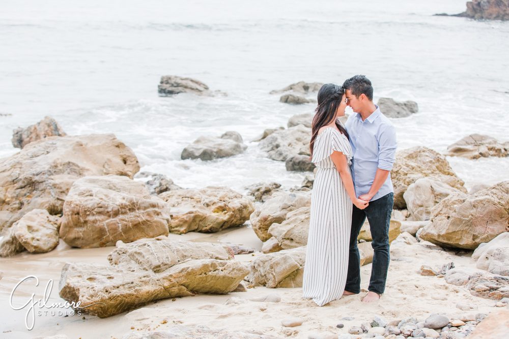 Corona Del Mar Beach Engagement Session, kiss, dress, portrait, engaged, couple, waves, sand, ocean