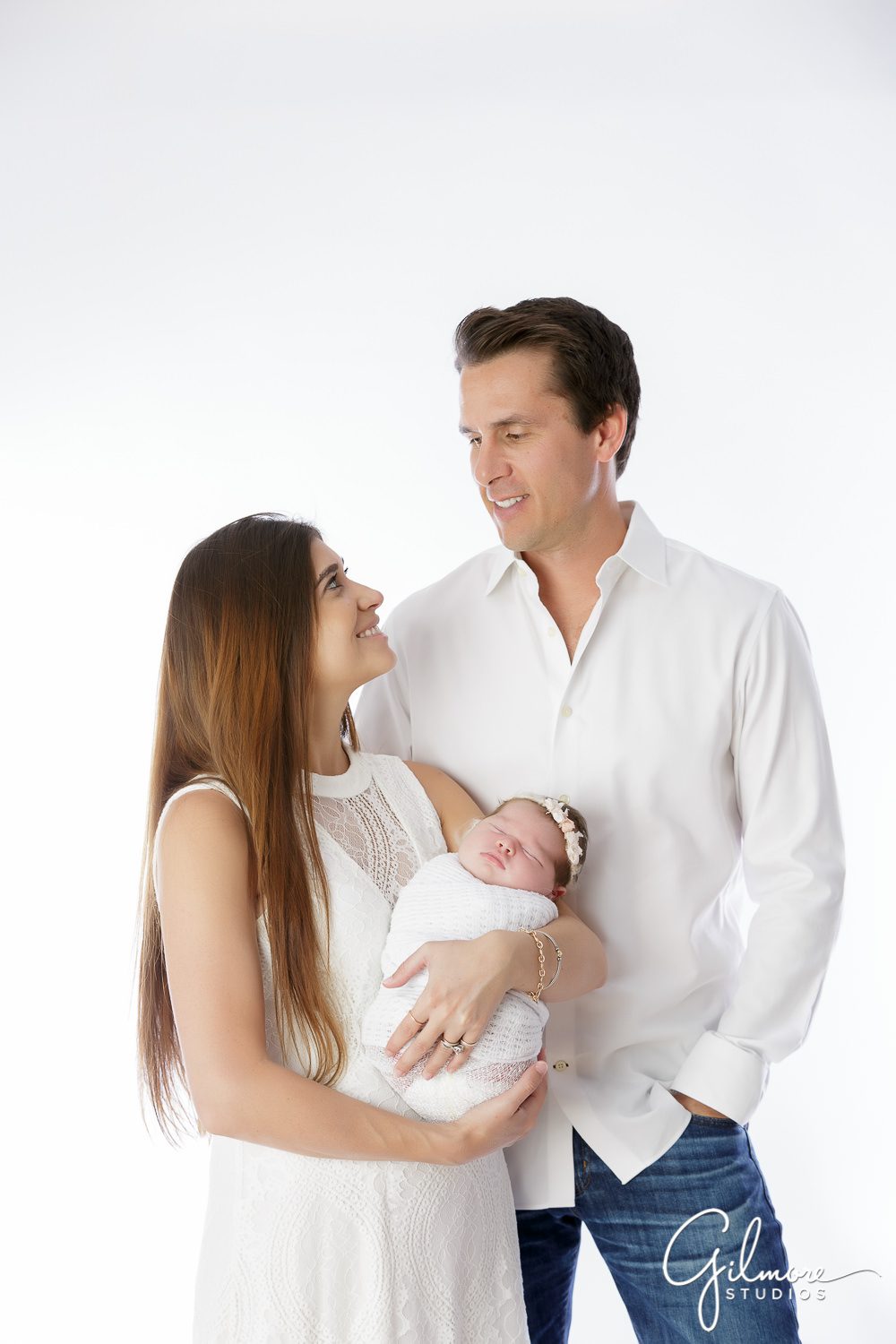 Orange County Newborn, parents, mom, dad, sleeping baby, jeans, shirt, white outfit, dress, blankets