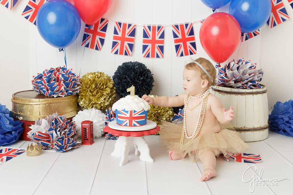 Princess London's 1st Birthday, baby, outfit, skirt, tutu, necklaces, headband, portrait photography, england themed cake smash, props, studio, balloons, first bday, one year old