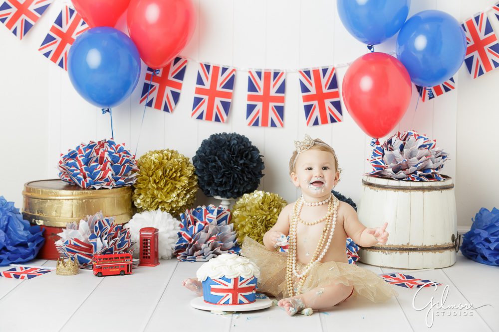 Princess London's 1st Birthday, portrait photography, studio, baby outfit, cake smash, first bday, family, pom poms, props, balloons, messy