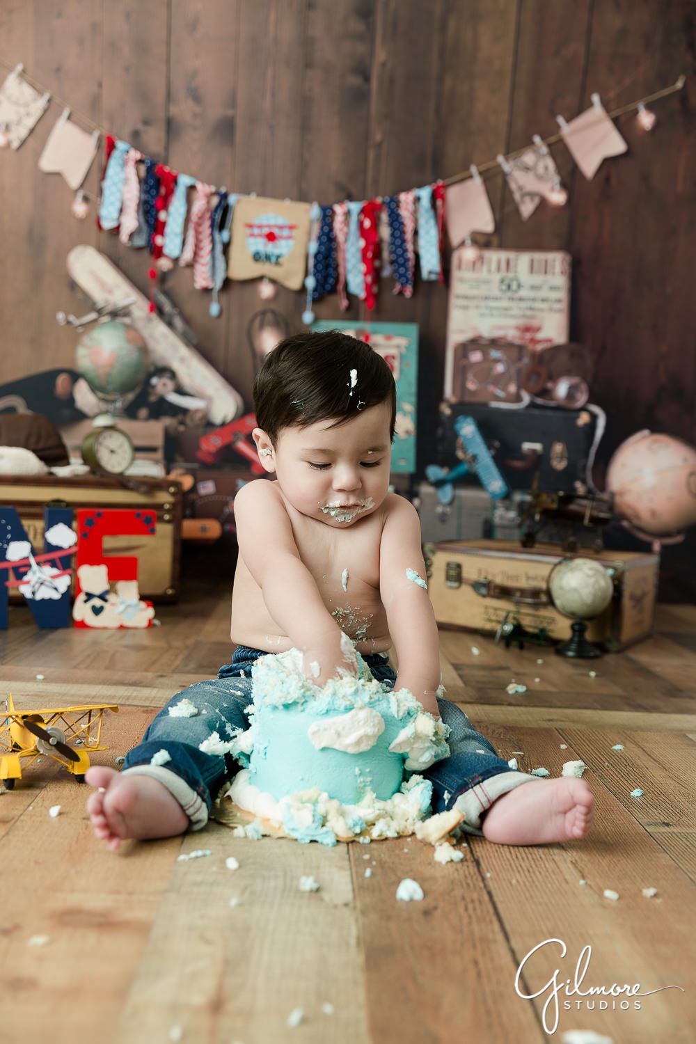 Aviator Cake Smash - Time Flies 1st Birthday Session, clouds, blue sky, biplane, airplanes, one year old boy, baby photographer