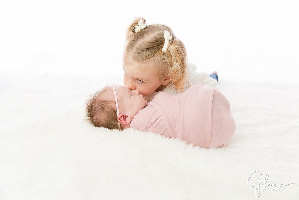 Newborn Family Photography Session, baby sister, pink wrap, baby posing, props, BirdieBaby Boutique, children