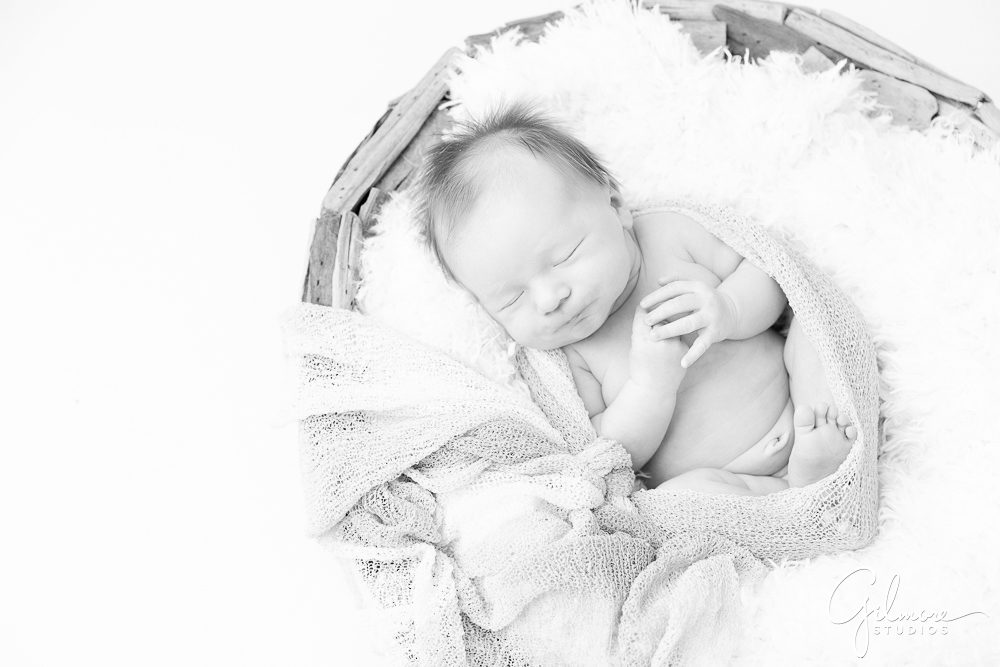 Newborn Family Photography Session, baby posing, wooden bowl, black and white photo