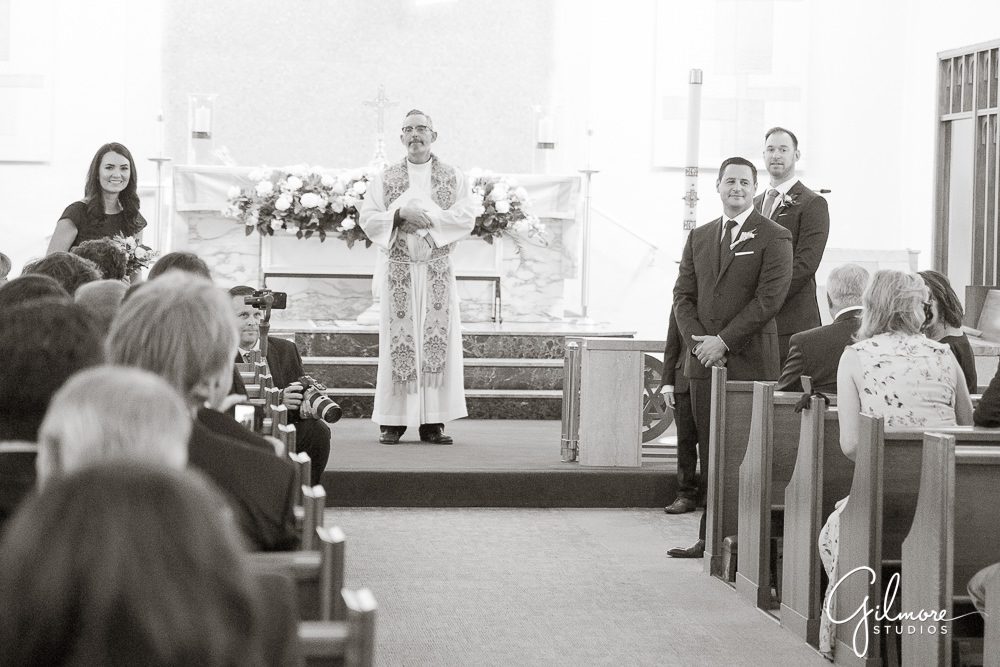 groom-waiting-for-the-bride-walking-down-aisle-ceremony-our-lady-mount-carmel-newport-beach-wedding-photo