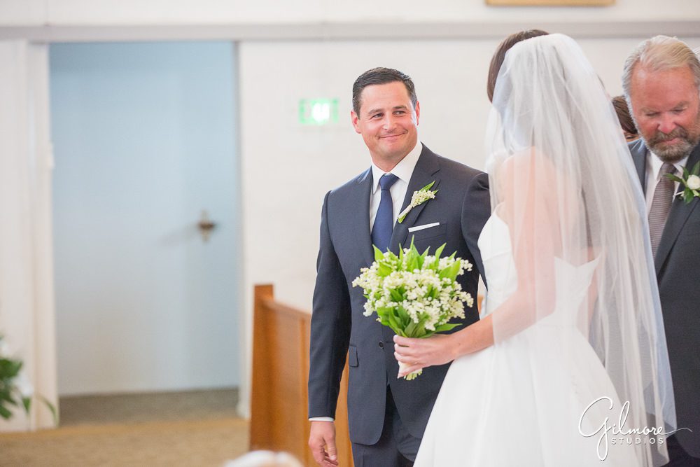 handing-off-the-bride-groom-aisle-ceremony-our-lady-mount-carmel-newport-beach-church-wedding-photography