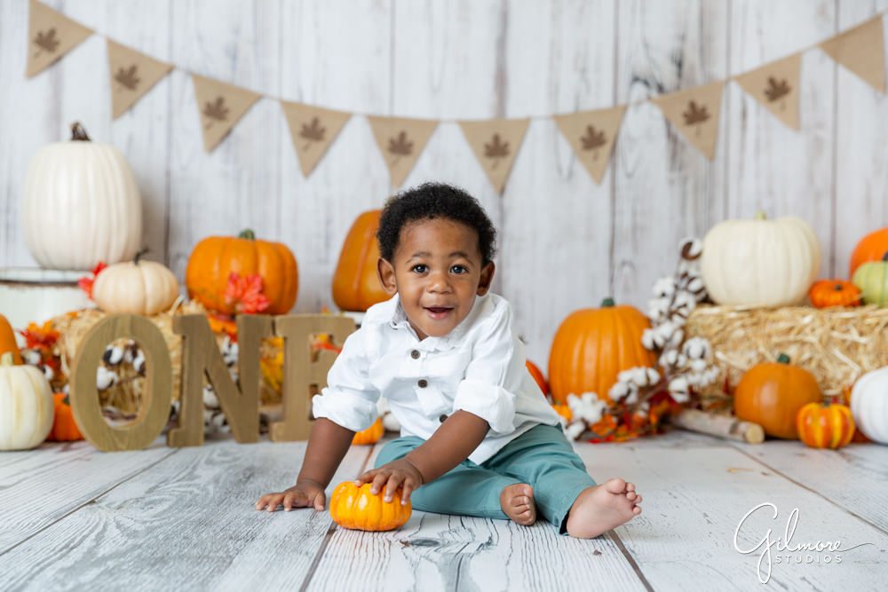 october cake smash for first birthday portrait session