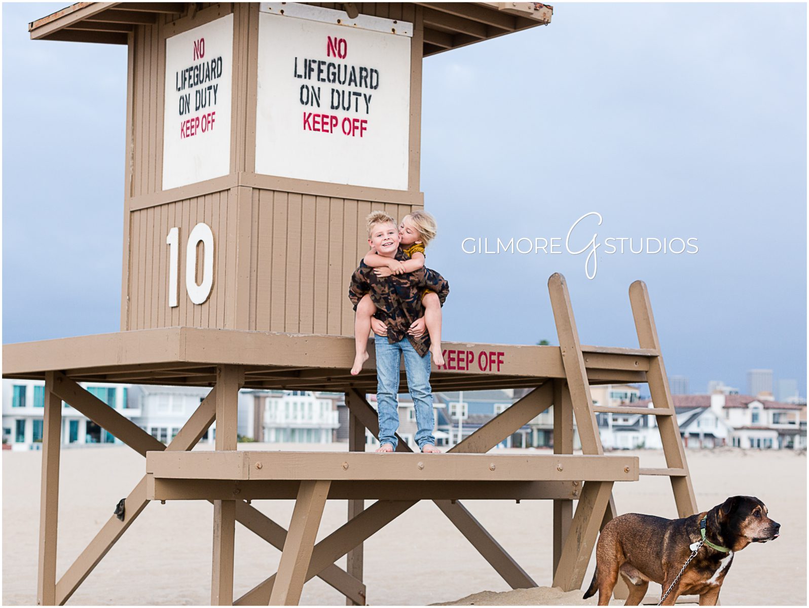 Orange County family photographers, Family Photos at the Beach, Newport, portrait session, lifeguard tower, dog, kids, children
