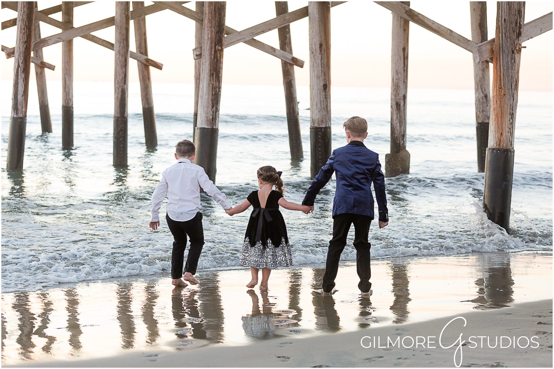holding hands on the beach, Formal Family Portrait, Newport Beach photographer