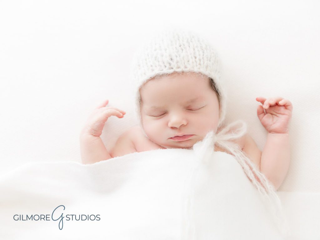 Newborn Baby Girl - Newport Beach Baby Photographer, white knit, hat, cap, beanie, props, posing, it's a girl, orange county baby studio Newport Beach, CA