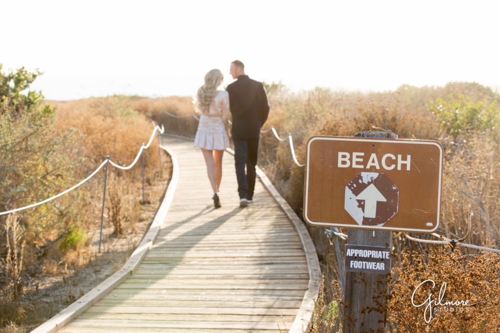 board walk, beach trail, Crystal Cove Engagement Photography Session, Newport Beach, cute short dress, outfit, outfits, skirt, Orange County wedding photographers, Gilmore Studios