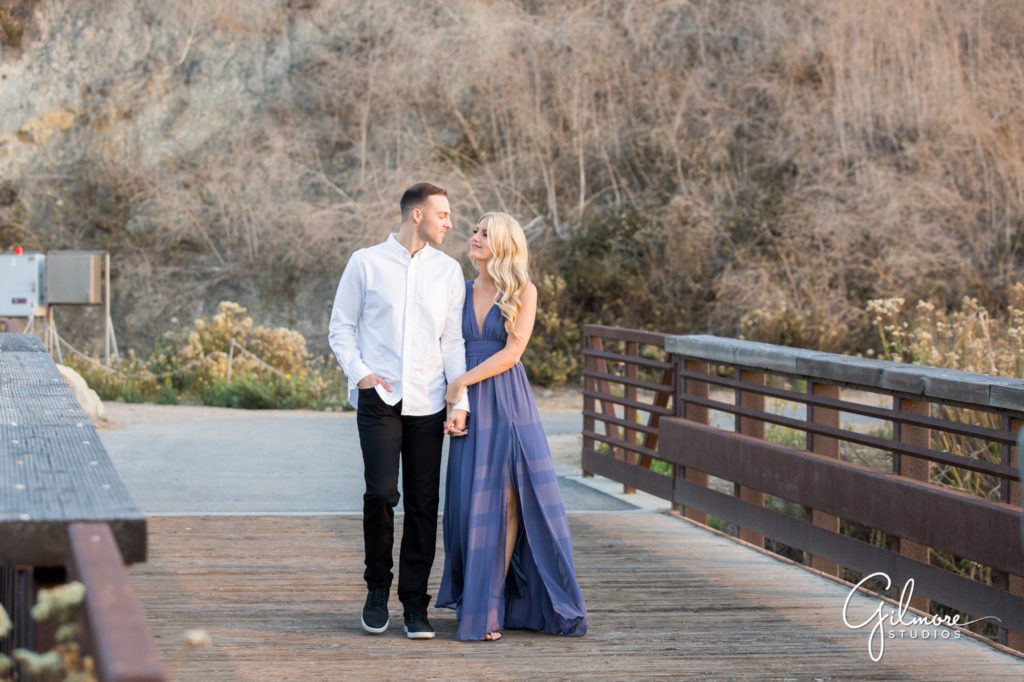 formal gown, Crystal Cove Engagement Photography Session, Newport Beach, cute short dress, outfit, outfits, skirt, Orange County wedding photographers, Gilmore Studios, purple dress, formal attire, state park beach, trail, bridge