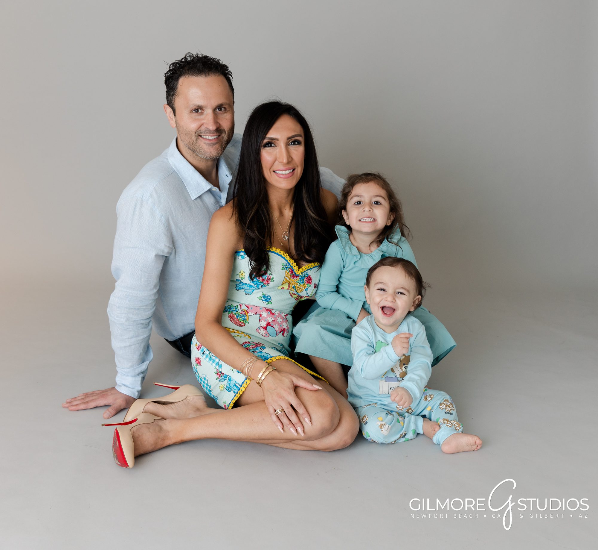 family studio photographer, grey background, seamless, photo studio in east valley AZ, Newport Beach portrait studio, Jennifer Gilmore, Gilmore Studios, family with one year old, siblings, mom and dad, brother and sister