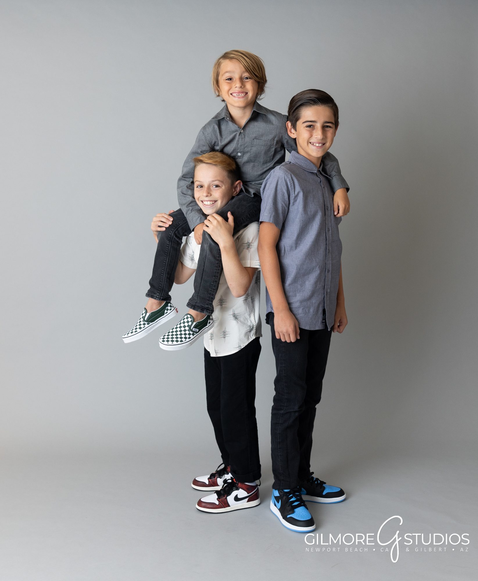 family minis in Orange County, CA - Newport Beach Photographer - Mini Sessions, studio family portrait on seamless gray backdrop. background, solid grey backgrounds, mom, dad, and 3 kids, boys, high key, GILMORE STUDIOS