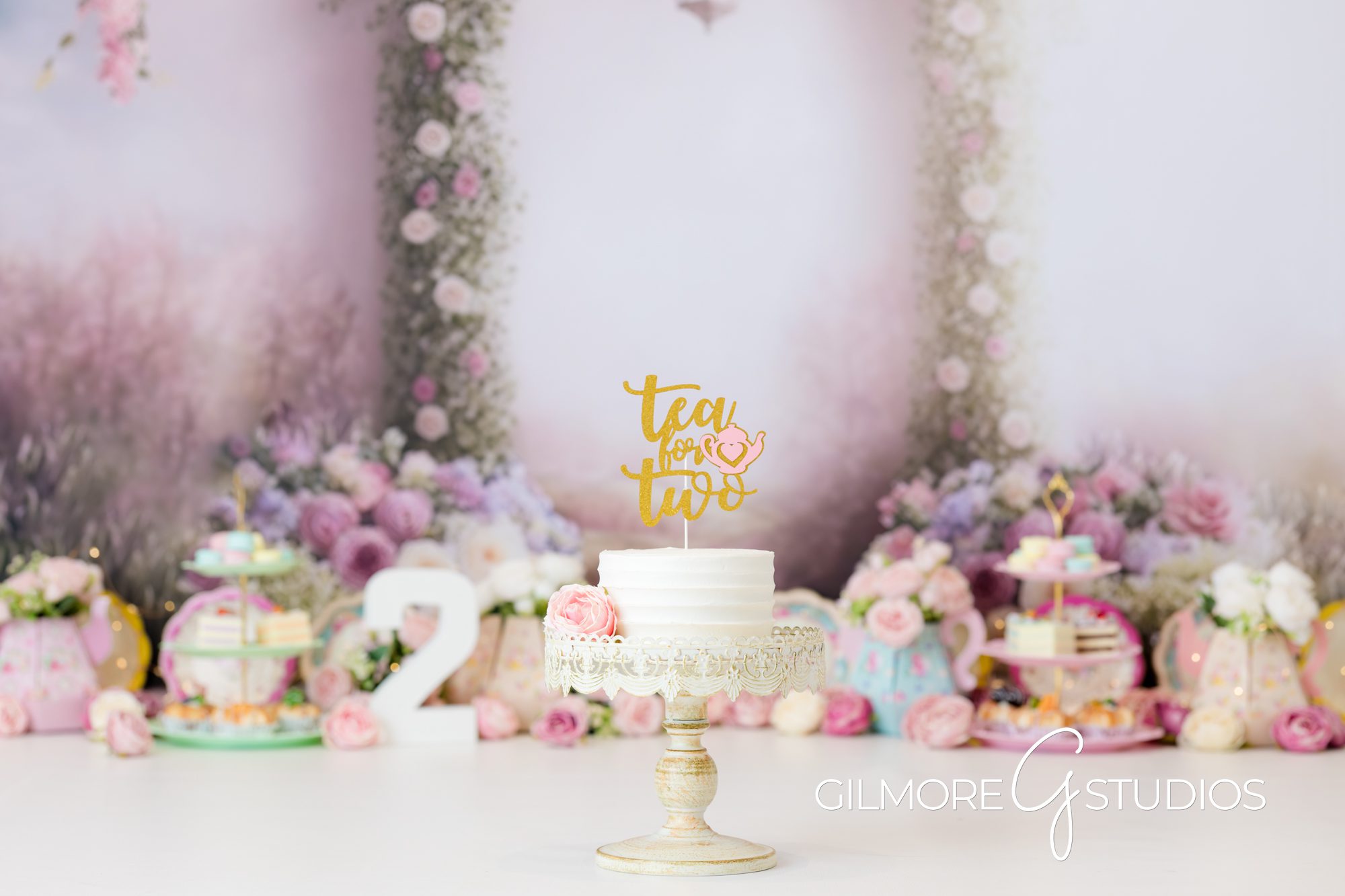 tea party cake smash, pink background, white cake, pink flowers, indoors, gilmore studios