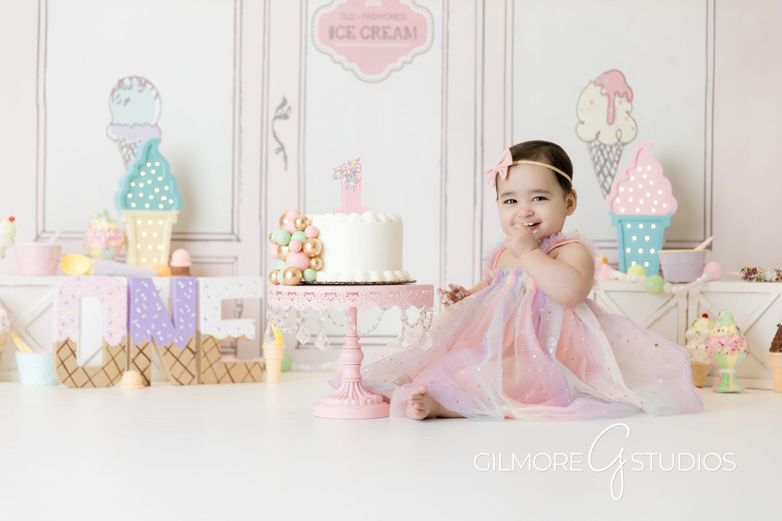 ice cream theme cake Smash, white cake, little girl, birthday, pink dress, pink bow, ice cream parlor, photography, Gilmore Studios