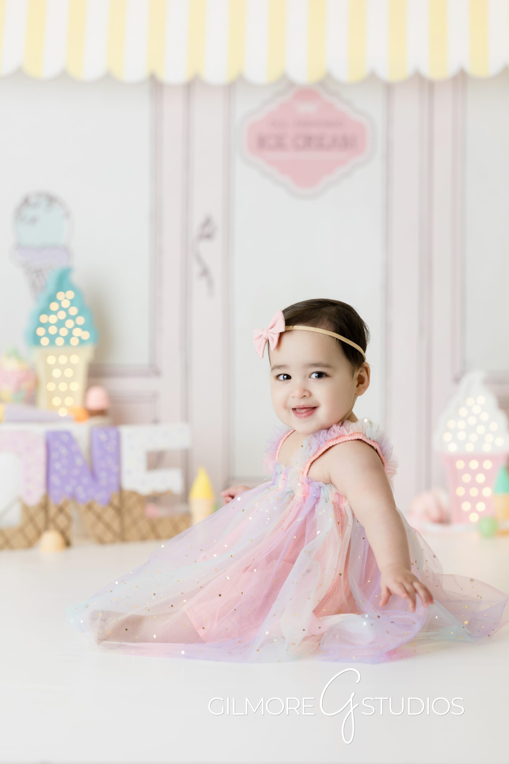 ice cream themed cake Smash, little girl, little girl wearing pink dress, pink bow, posing, photography, Gilmore Studios
