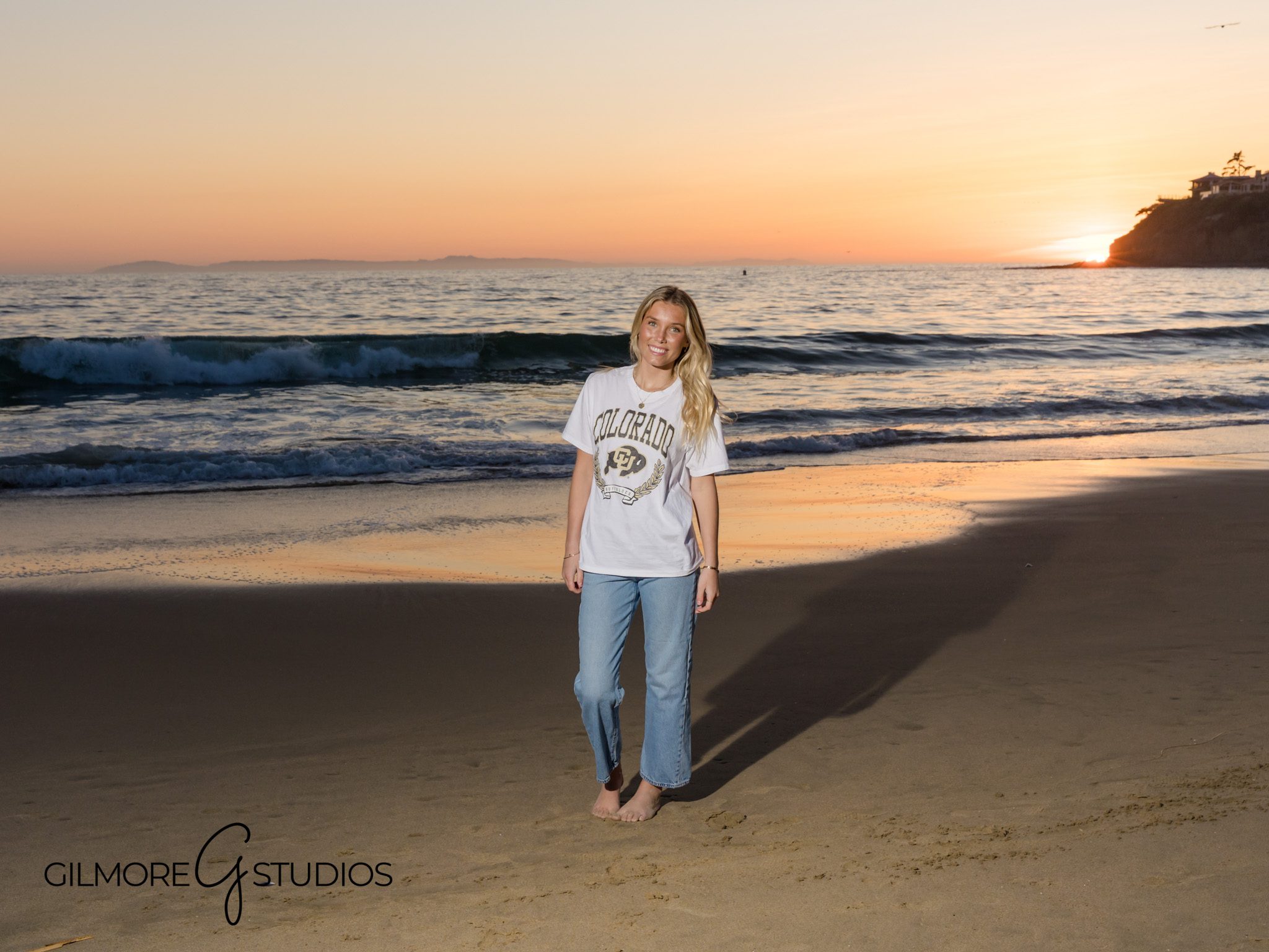 High school senior on the beach at Laguna Beach, ocean breeze, sunset light