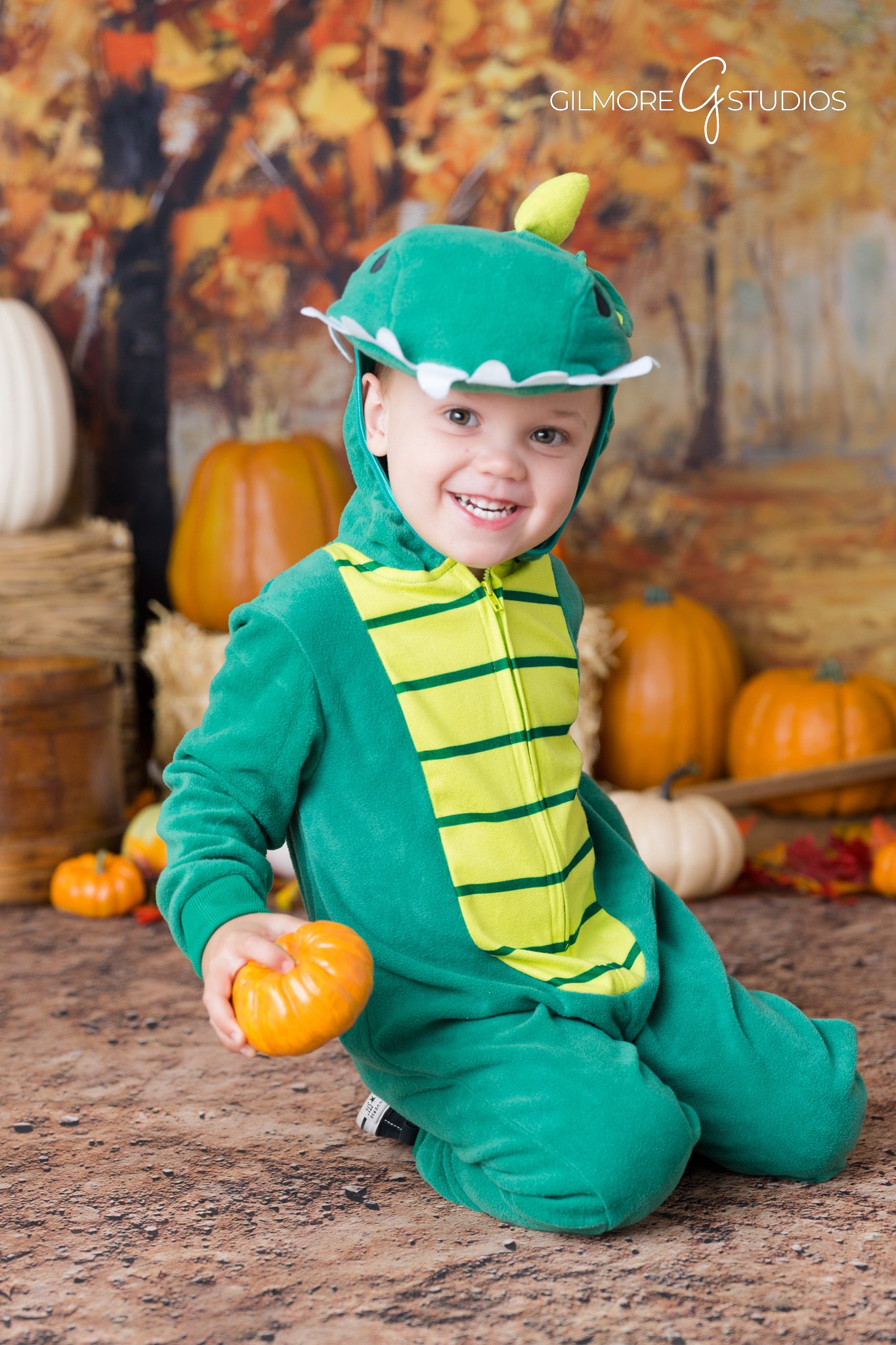 Studio backdrop – fall tones – smiling family photo