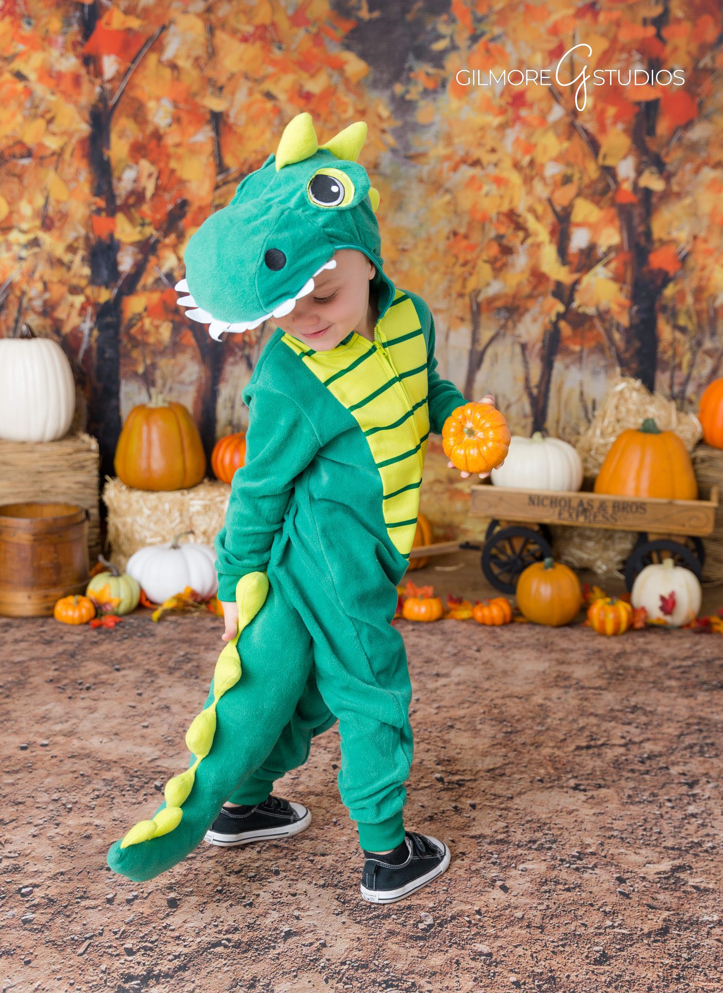 Gilmore Studios family photo – rustic backdrop – fall colors