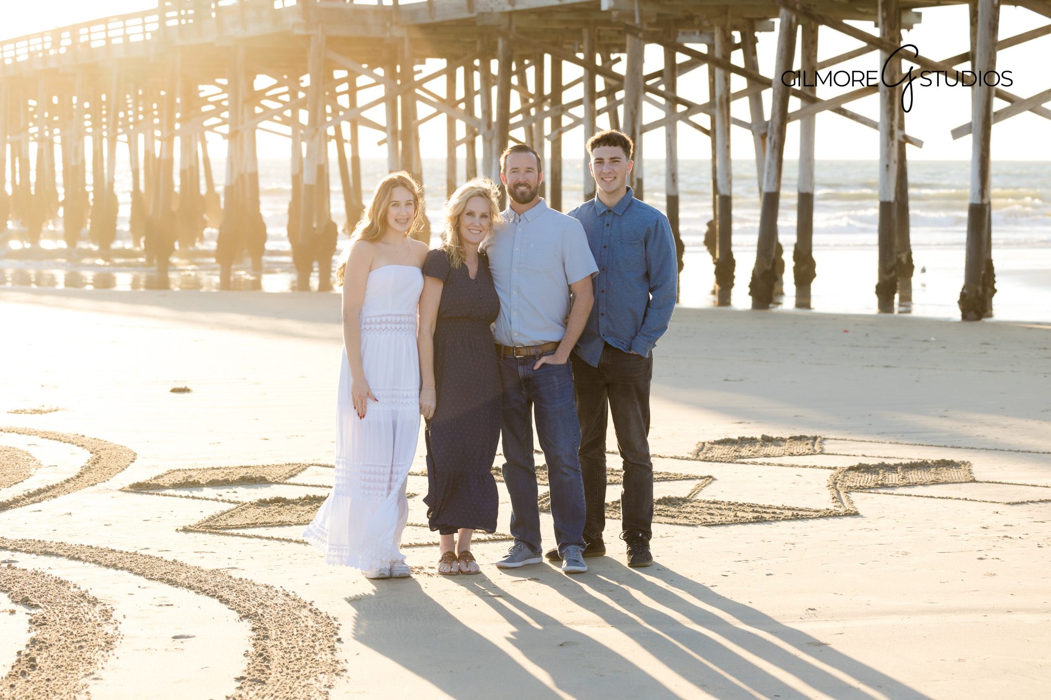 Footprints in the sand during family session