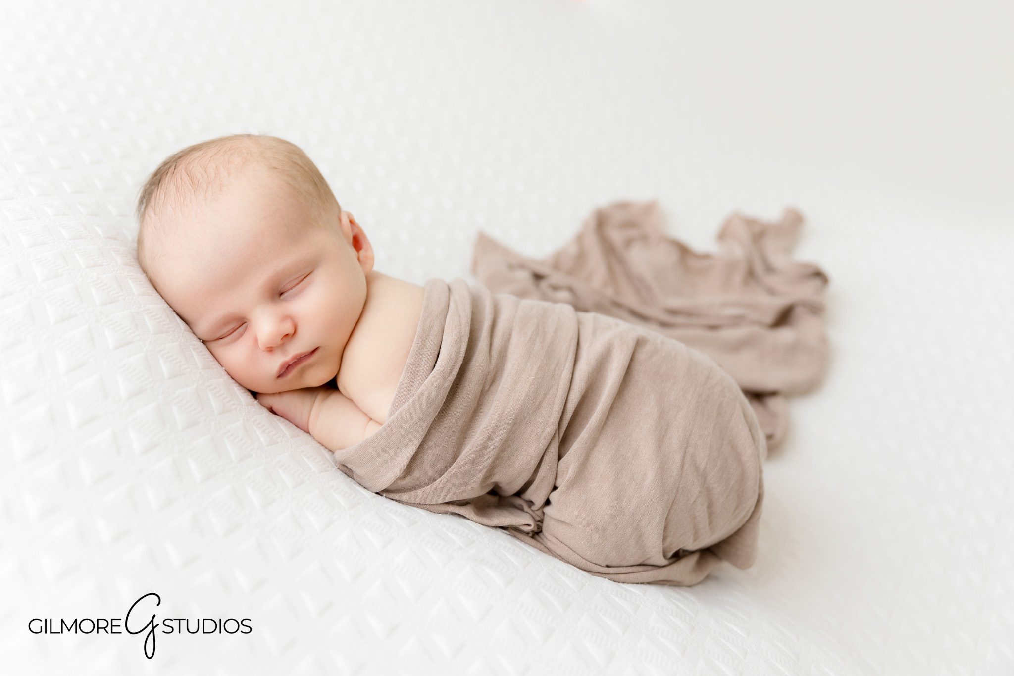 Baby sleeping on textured blanket

