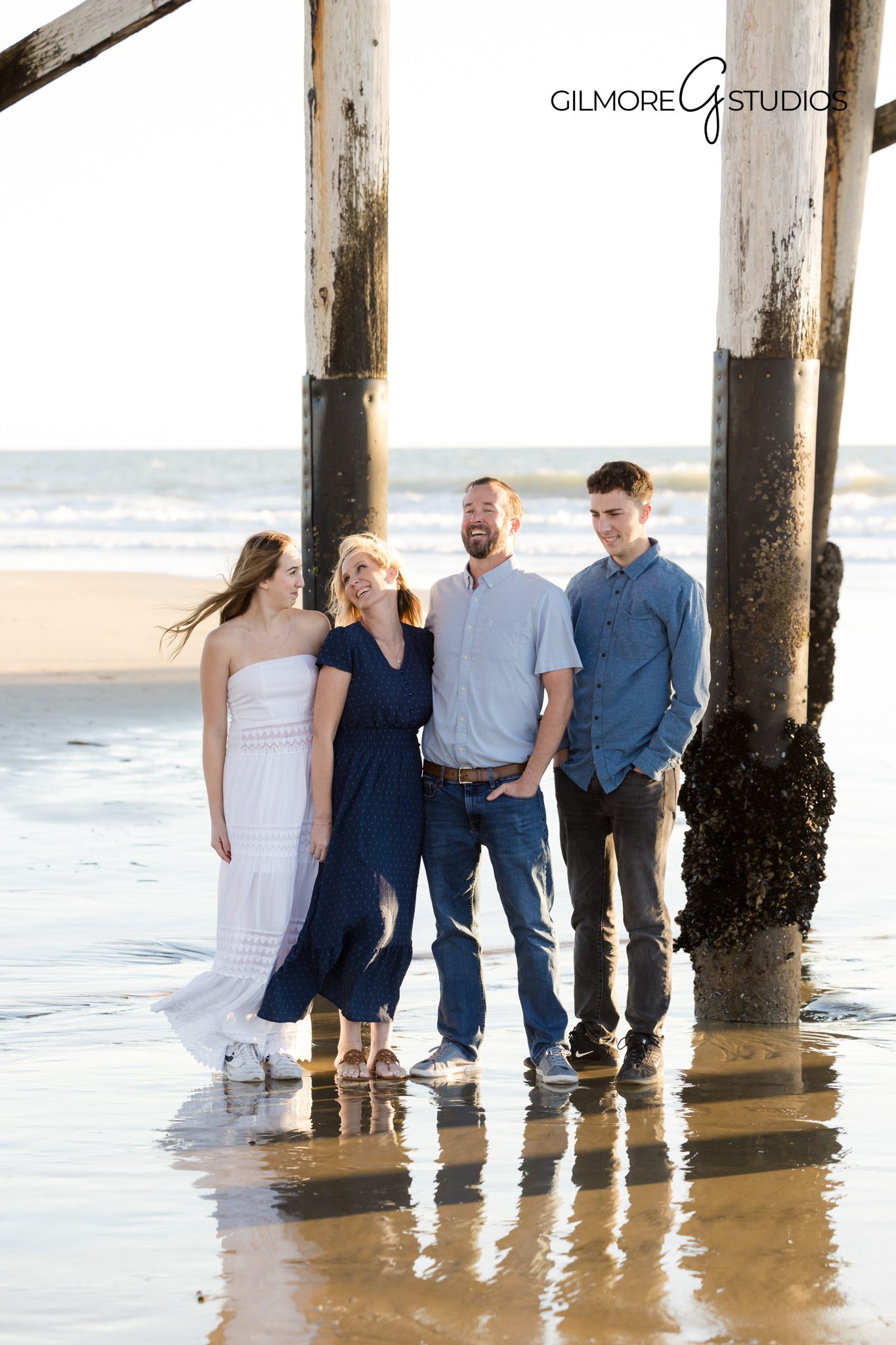 Candid family moment in front of the ocean