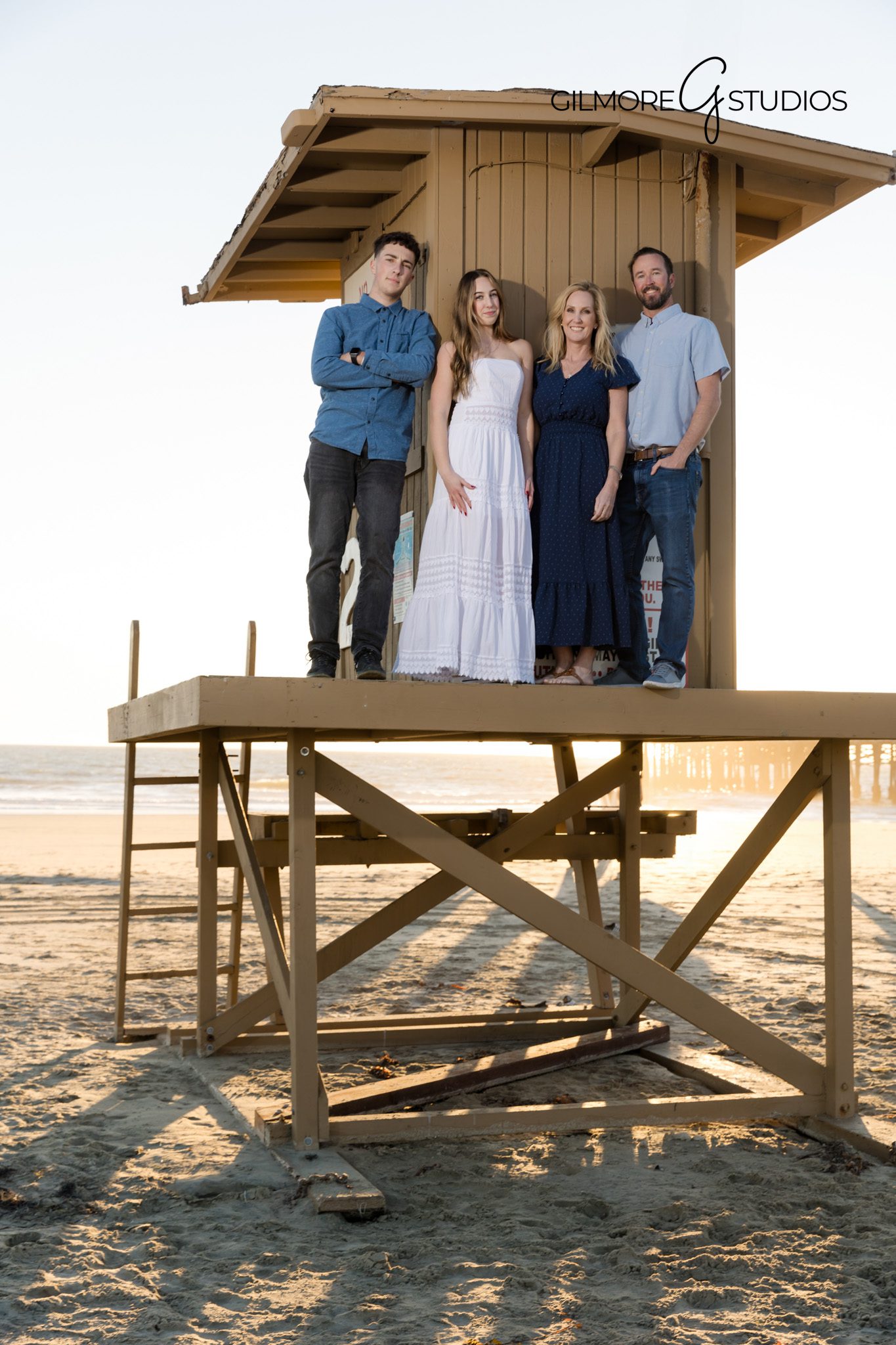 Family group photo with pier shadows