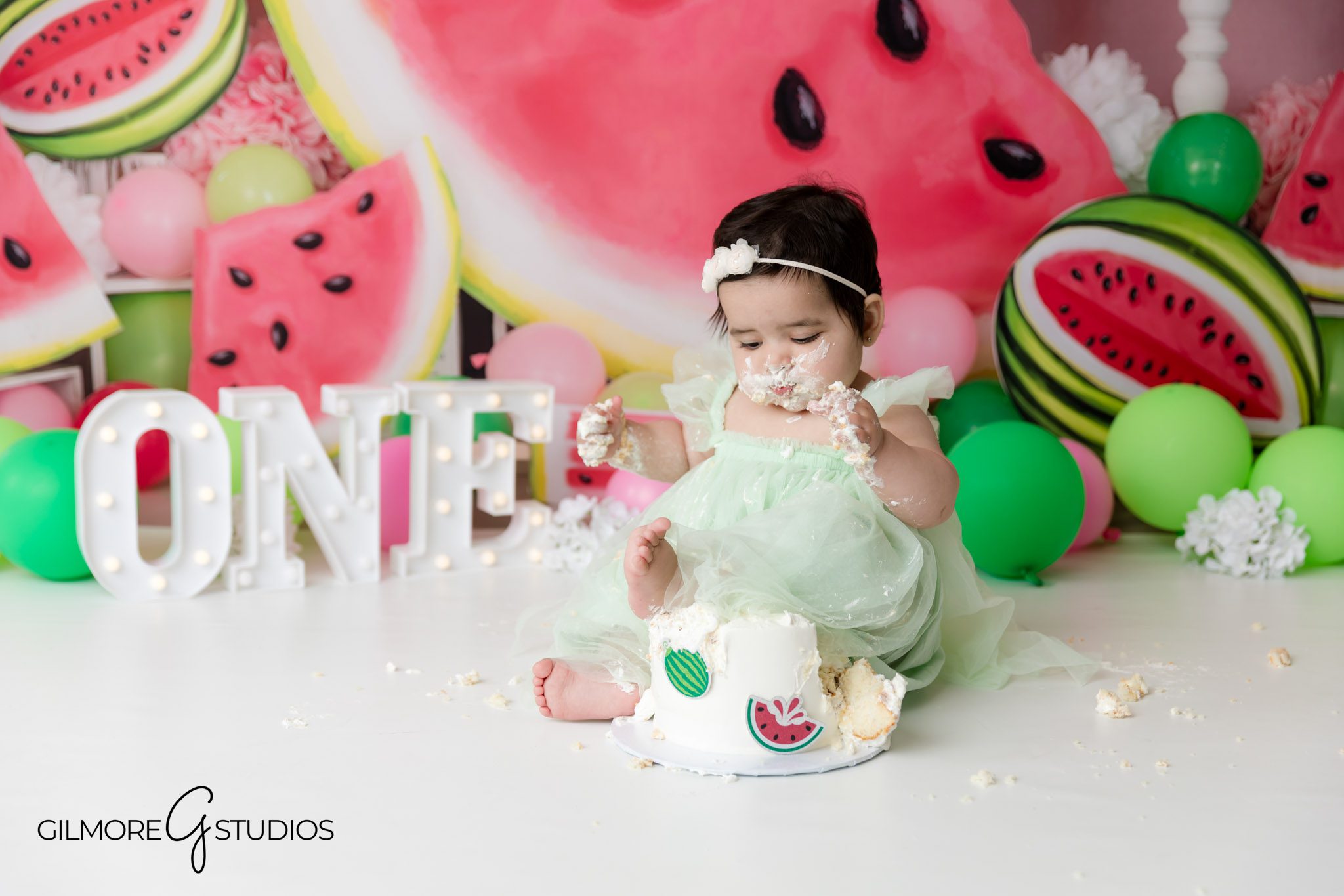 summer cake smash, summertime, watermelon cake smash, pink and green colors, summer themed, light green dress, floral headband, one year old first birthday, set design, newport beach photographer