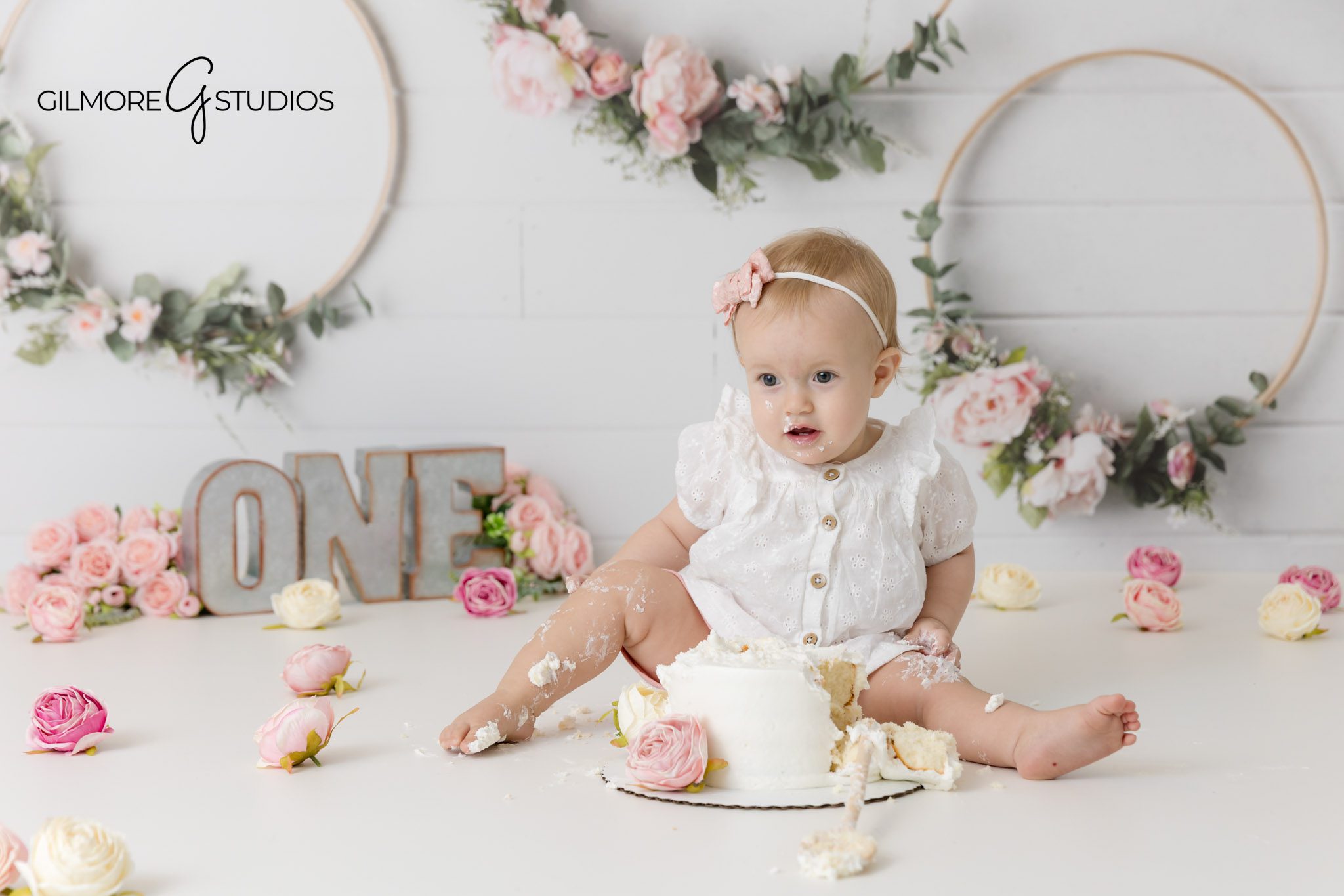 Custom birthday setup for cake smash photography in Mesa Arizona, Arizona photographer capturing messy cake smash birthday moment