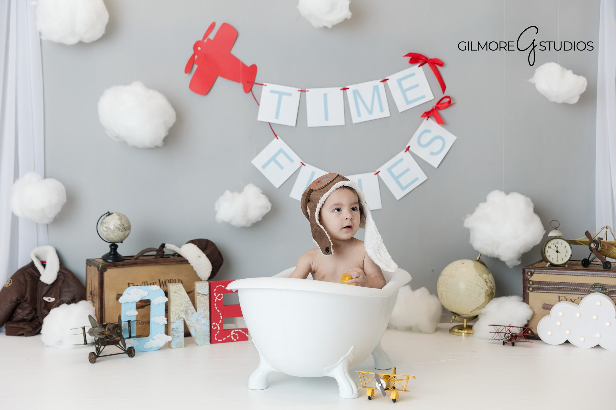 Neutral grey cake smash photography Gilbert AZ baby boy birthday with airplane details, Gilbert Arizona cake smash session Time Flies theme baby boy first birthday photography