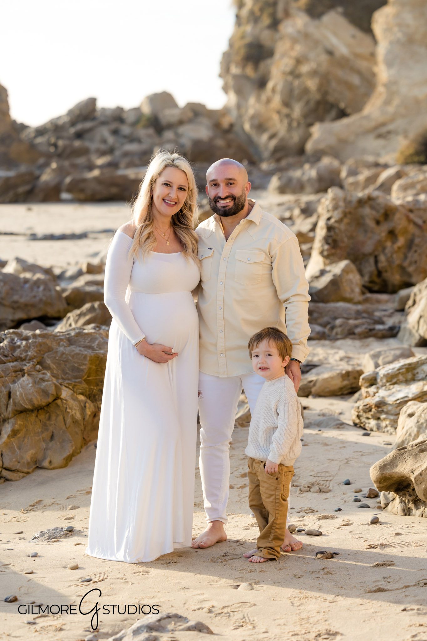 Scenic tide pool maternity portraits in Newport Beach, Pregnancy photo shoot by waves and cliffs