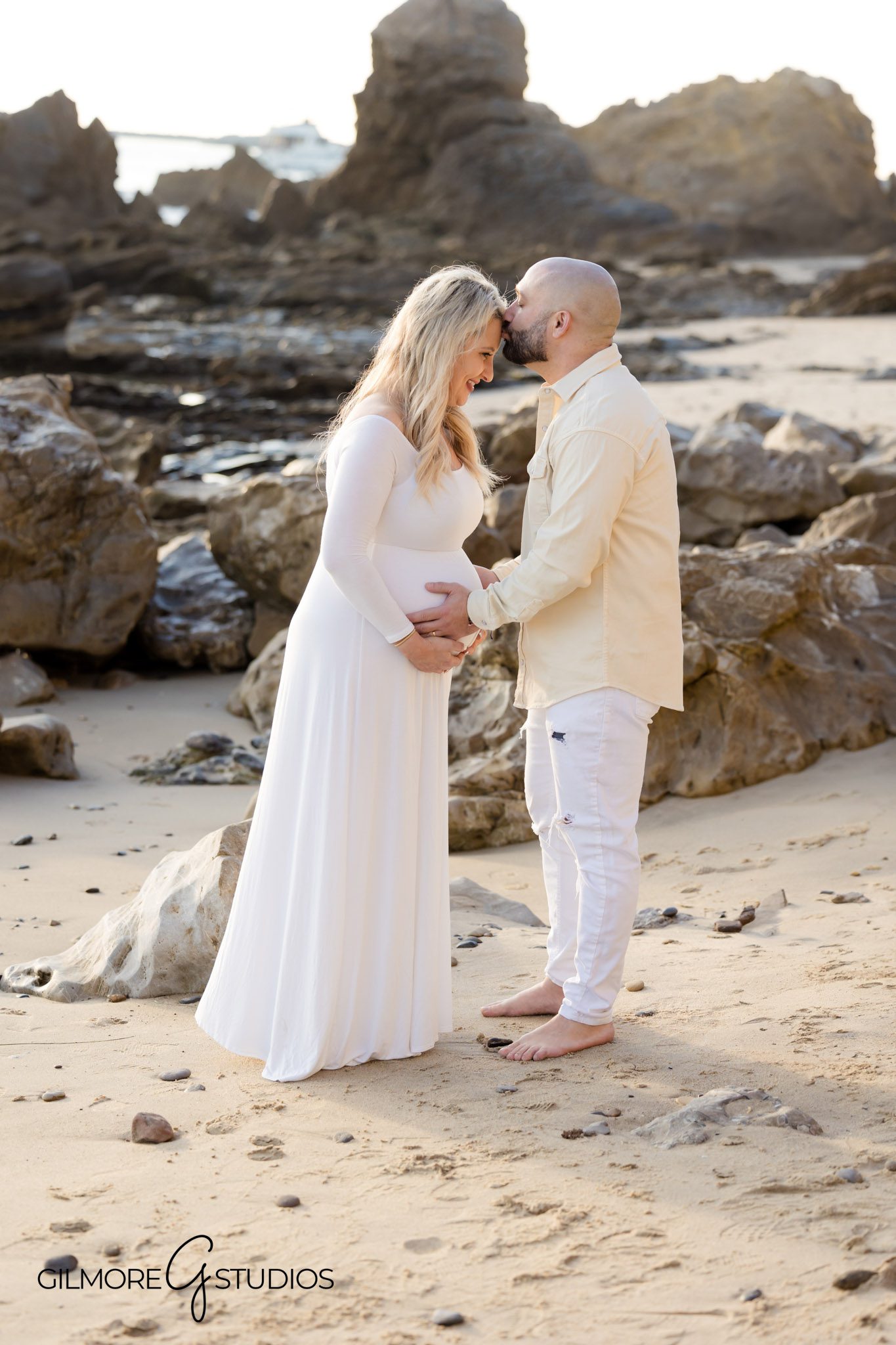 Natural light maternity portrait session in Orange County, Dreamy golden hour maternity photo shoot at the beach