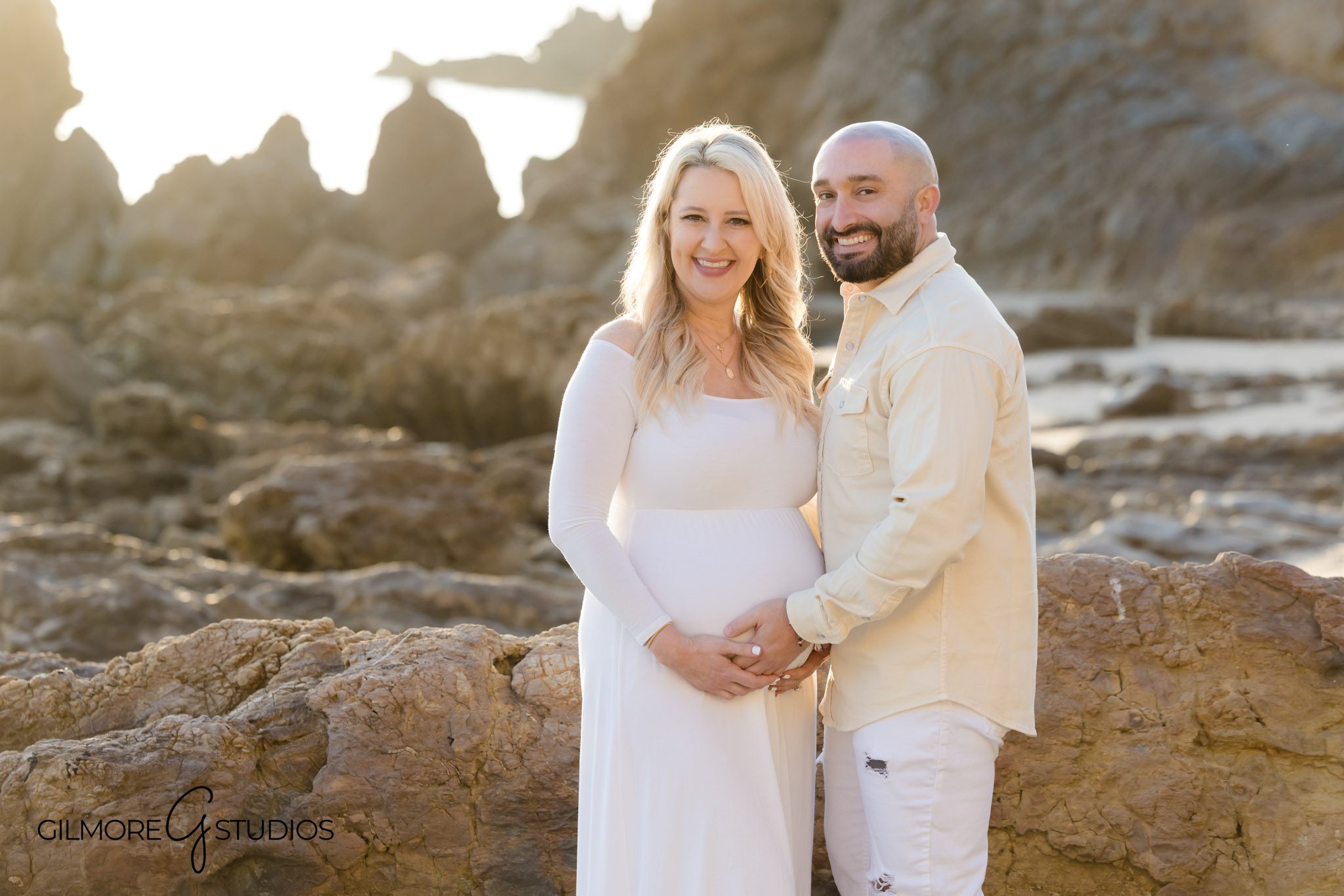 Southern California maternity photographer session at Little Corona, Couple maternity photos on the sand in Newport Beach