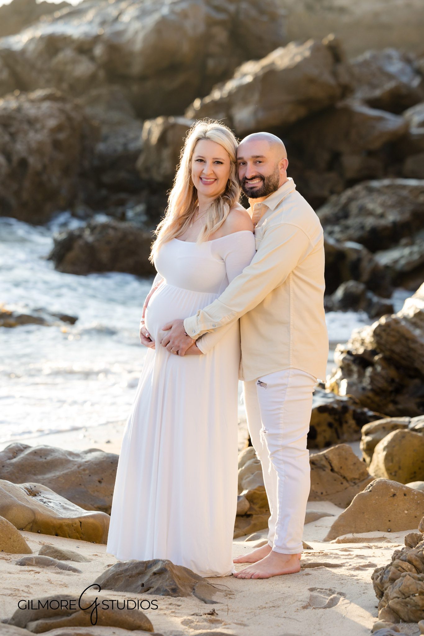 Couple maternity photography at Southern California beach, Editorial-style beach maternity photo in Newport Beach