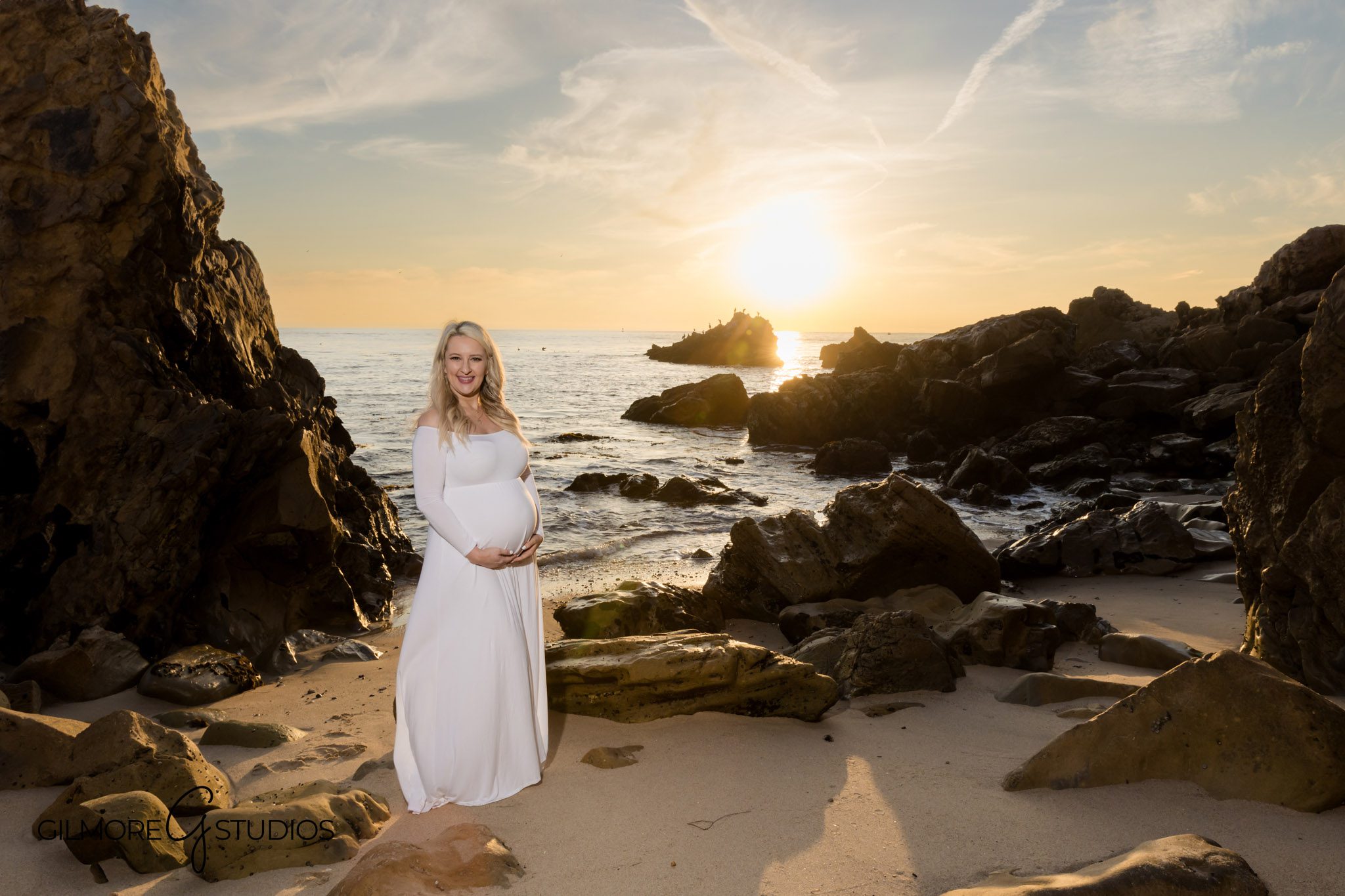 Coastal maternity photography with ocean rocks at Little Corona del Mar, Beach maternity portrait session in Newport Beach tide pools