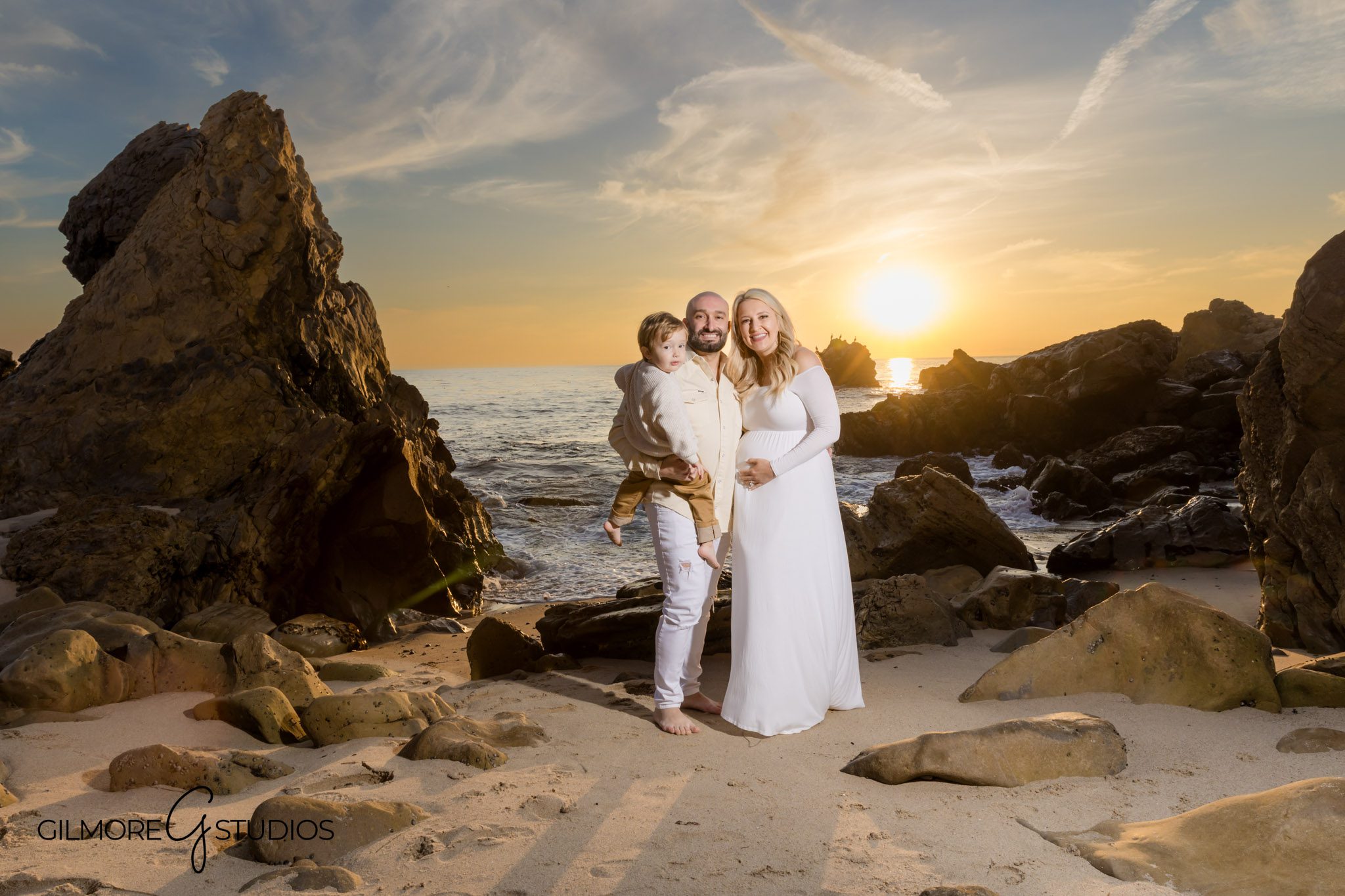 California maternity portrait session with coastal views, Full-length maternity portrait with tide pools in background