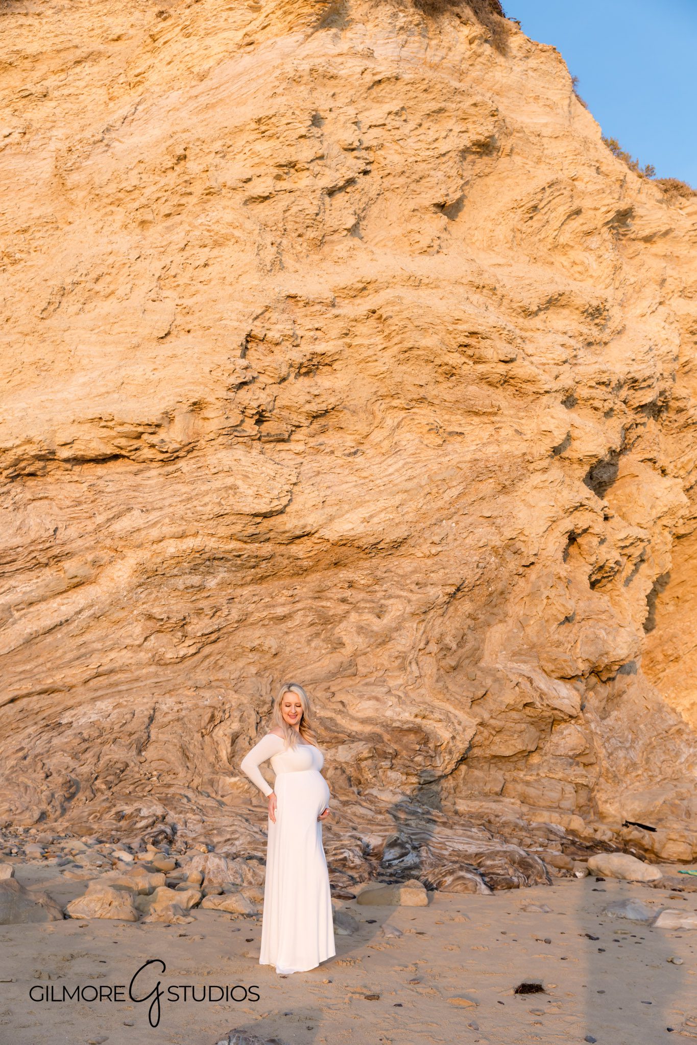 Little Corona del Mar maternity portraits in natural light, Soft neutral maternity outfit at beach by local photographer