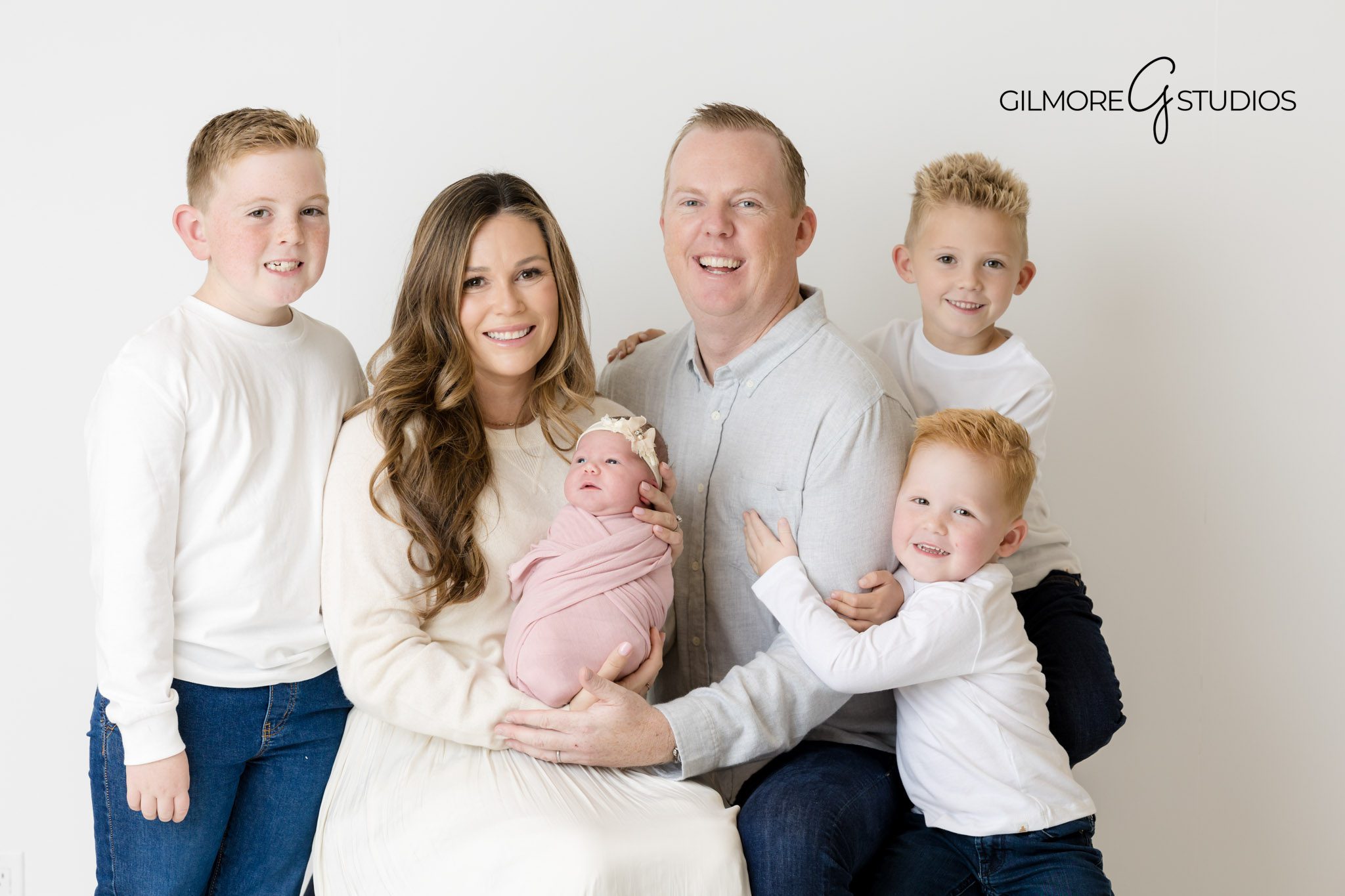 studio newborn session inspiration Pinterest, best Newport Beach baby photographer, top studio setup for newborn photos, newborn in soft wrap photography pose