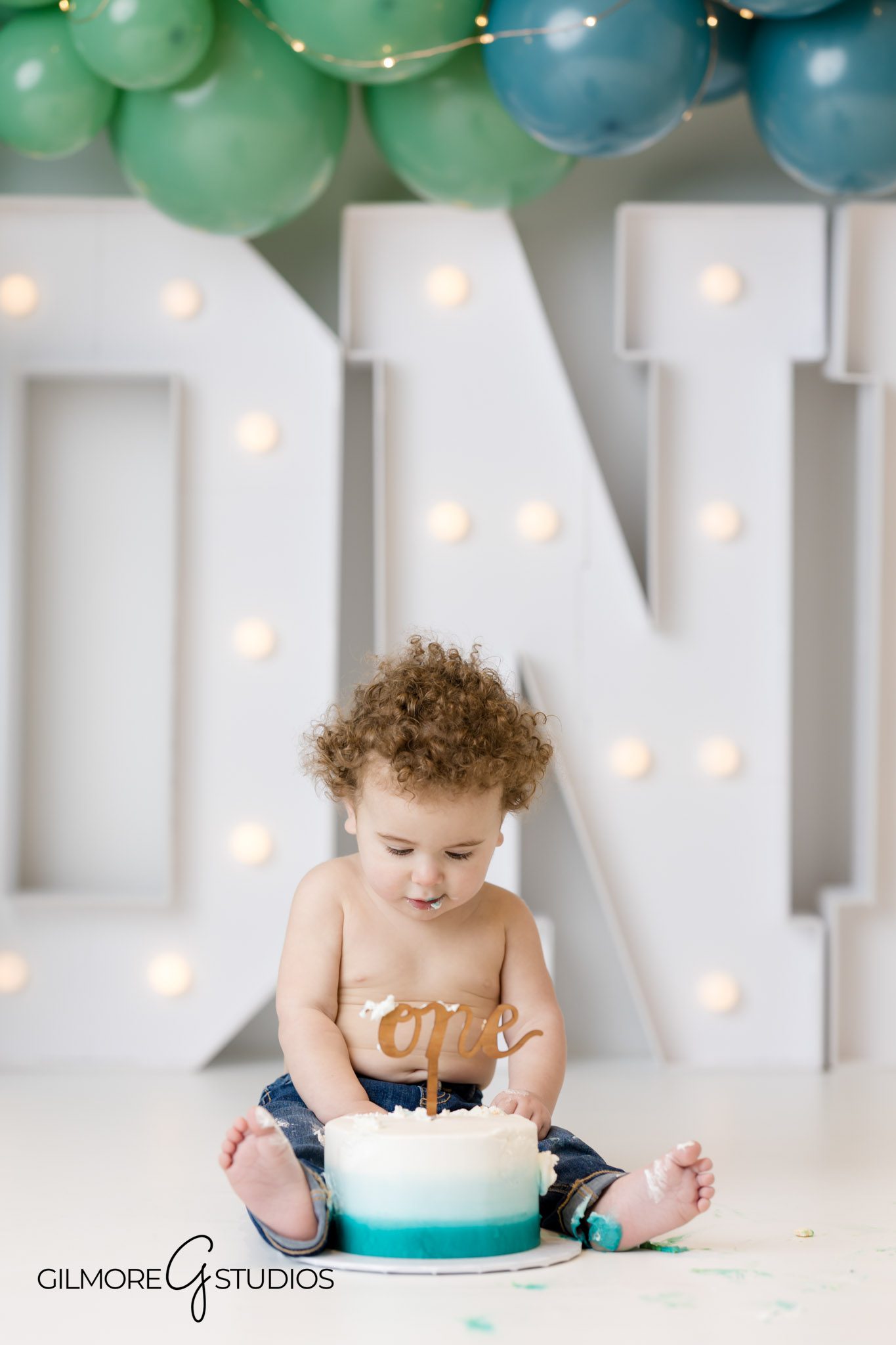 First birthday portrait Newport Coast with balloon backdrop, Newport Coast milestone cake smash photographer