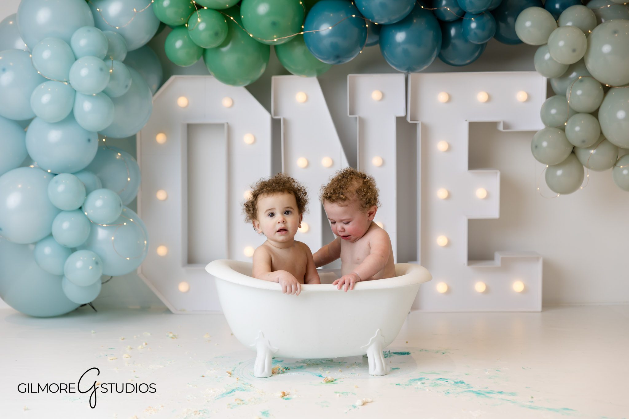 Blue and green cake smash balloon backdrop photographer, Newport Coast baby milestone photography with balloons