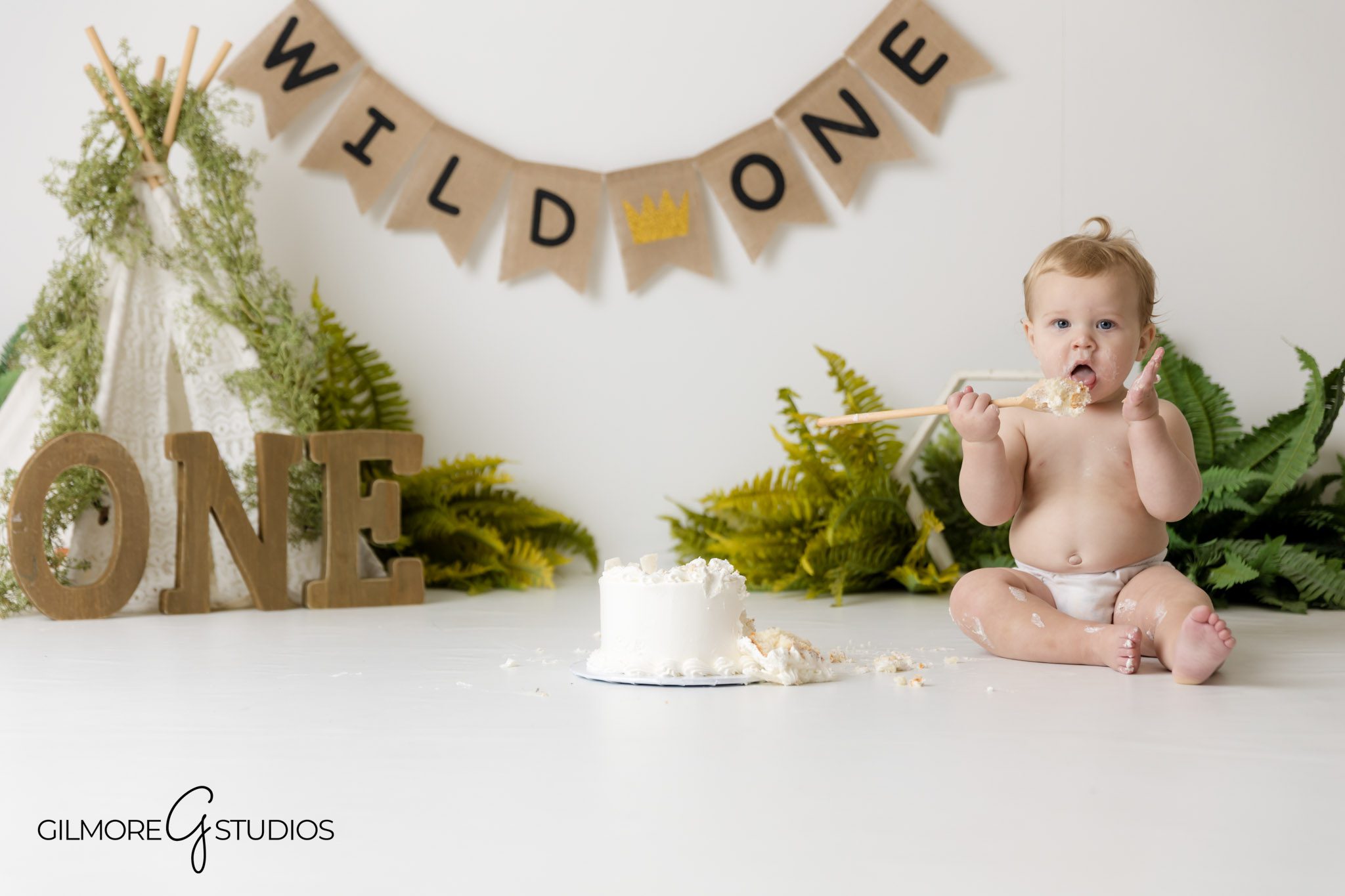 wild one milestone portraits in neutral tones Newport Coast photographer, boho cake smash photography Newport Coast with rustic decor