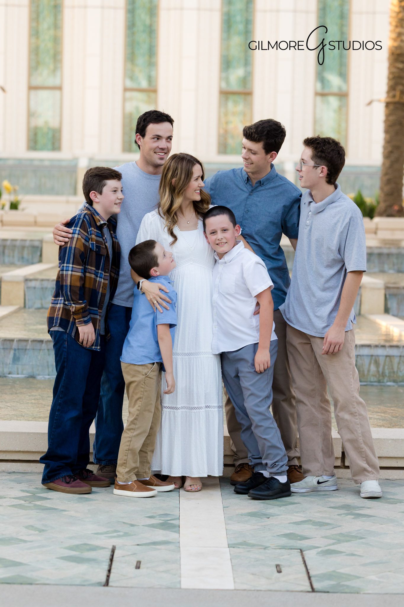 Arizona LDS Temple photography for large family portraits, Gilbert LDS Temple photographer family posing together outdoors