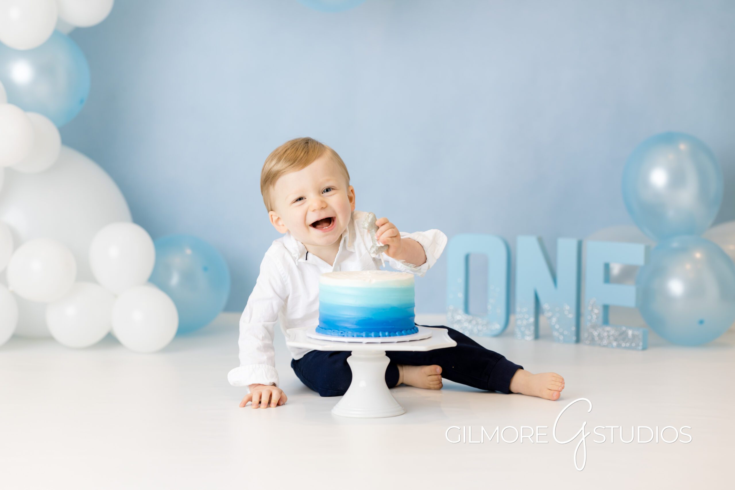 Baby boy cake smash outfits Gilbert Arizona first birthday photoshoot, Gilbert AZ blue cake smash birthday portraits baby boy milestone photos