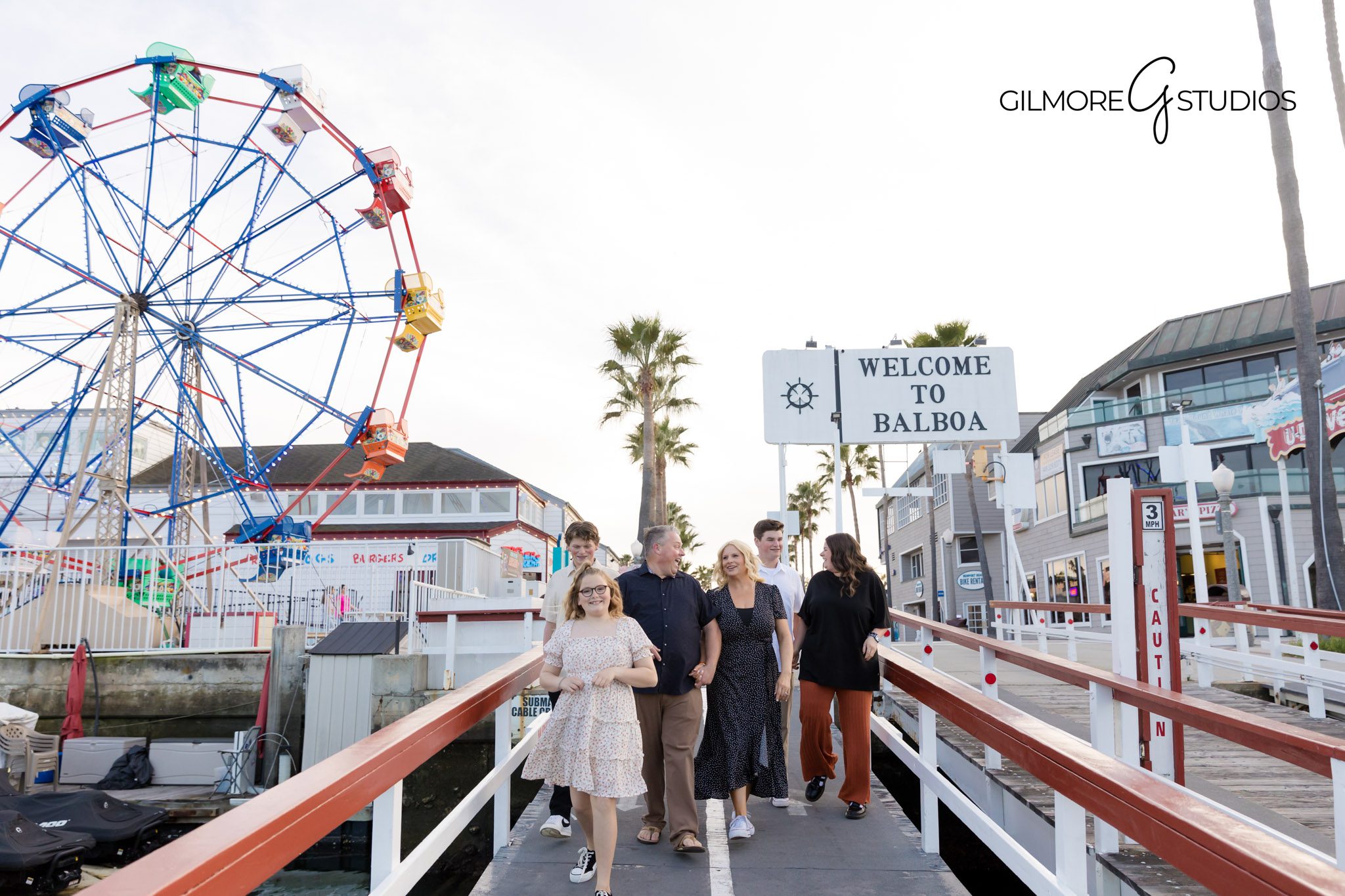 Family photographer Newport Beach Balboa Fun Zone colorful boardwalk pictures
Balboa Fun Zone candid family portraits Orange County California photographer
