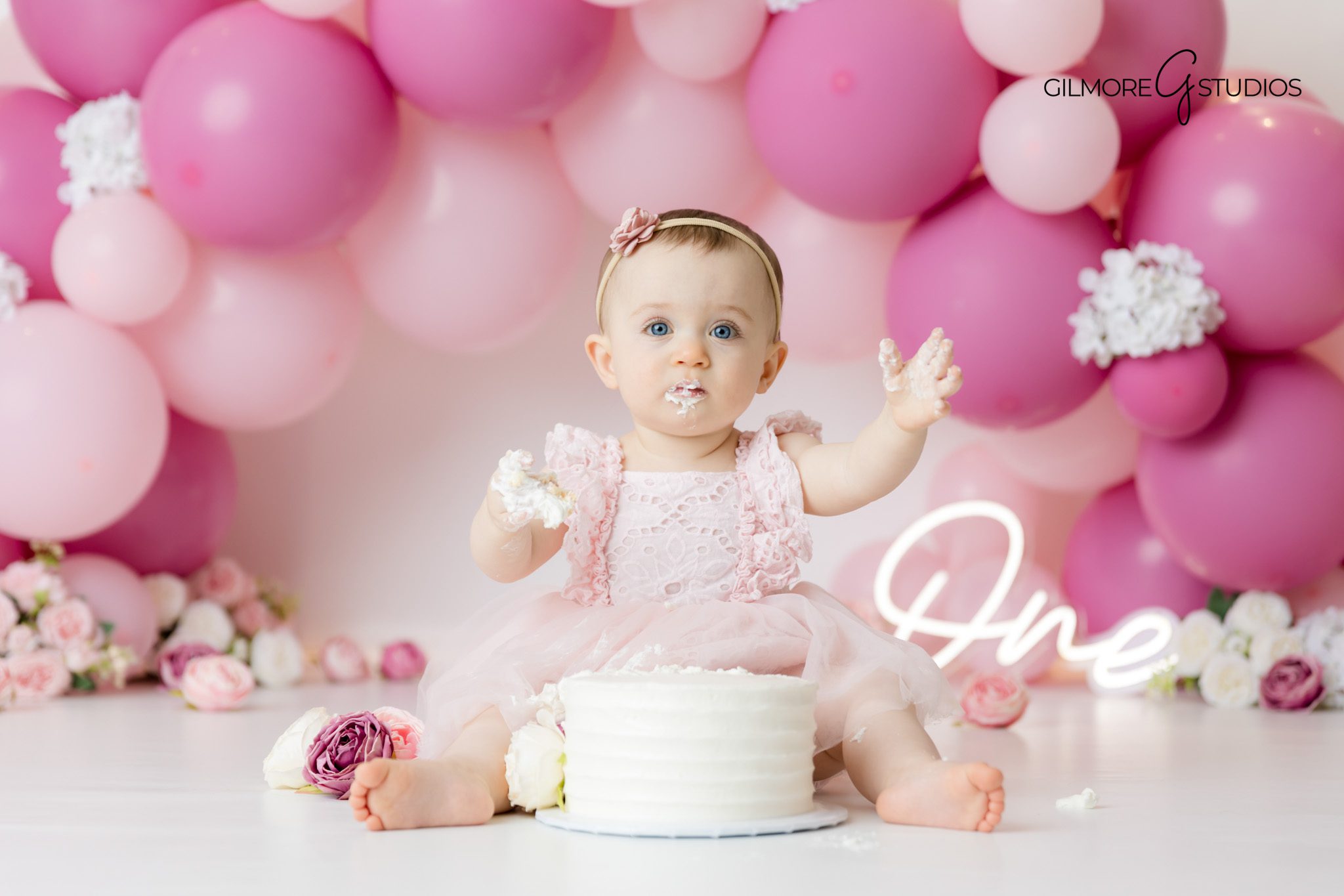 Pink balloon cake smash theme by Queen Creek photographer Gilmore Studios

First birthday cake smash photography Queen Creek AZ pink balloon setup