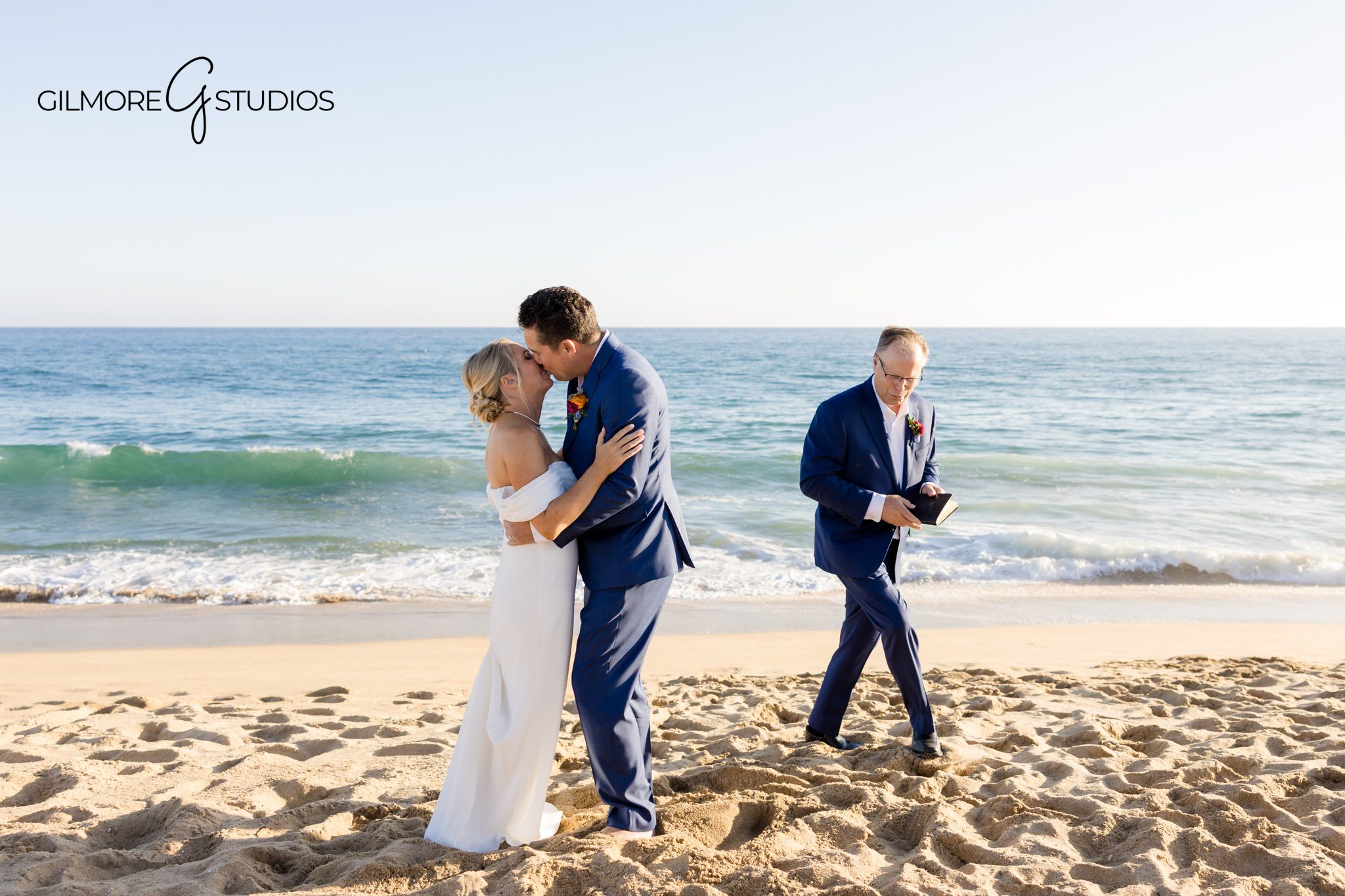 Newport Beach yacht club wedding ceremony Gilmore Studios photography portraits
Bride and groom kiss at sunset Newport Harbor Yacht Club Newport Beach wedding photographer